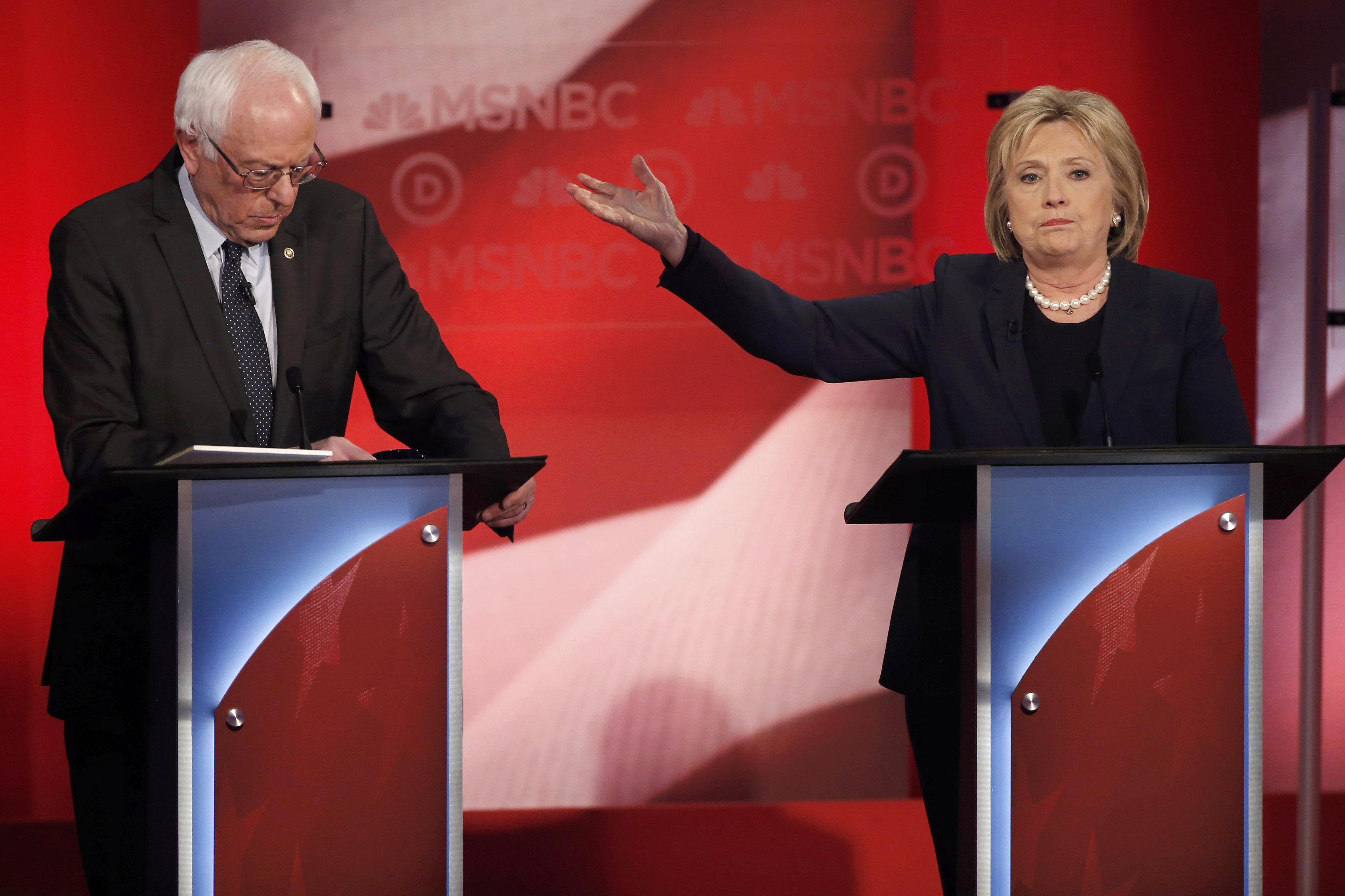 Democratic U.S. presidential candidate and former Secretary of State Clinton talks about Senator Sanders as they discuss issues during the Democratic presidential candidates debate sponsored by MSNBC at the University of New Hampshire in Durham