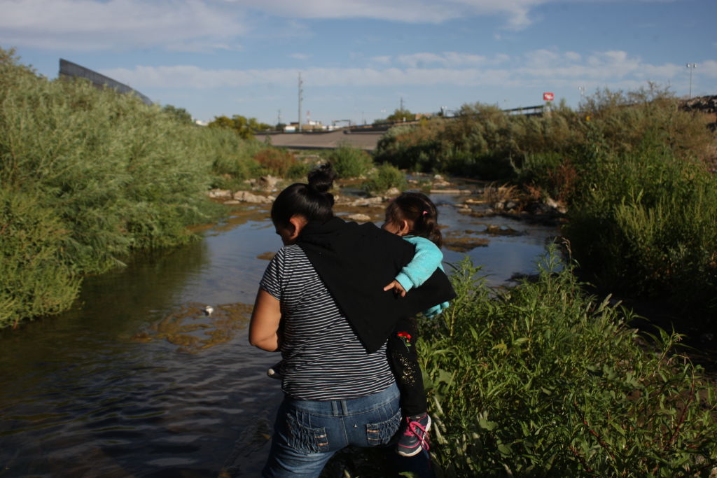 Central American Migrants Cross The Rio Bravo To Surrender To Border Patrol
