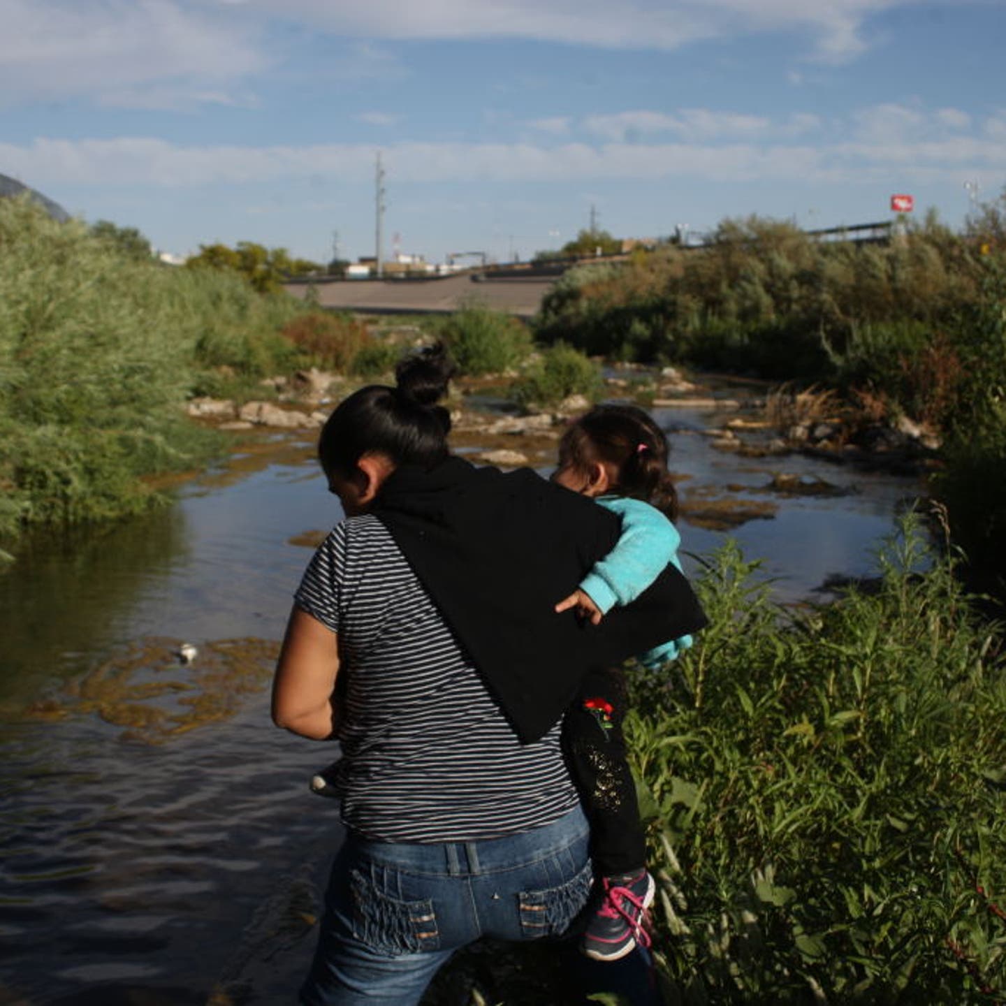 Central American Migrants Cross The Rio Bravo To Surrender To Border Patrol