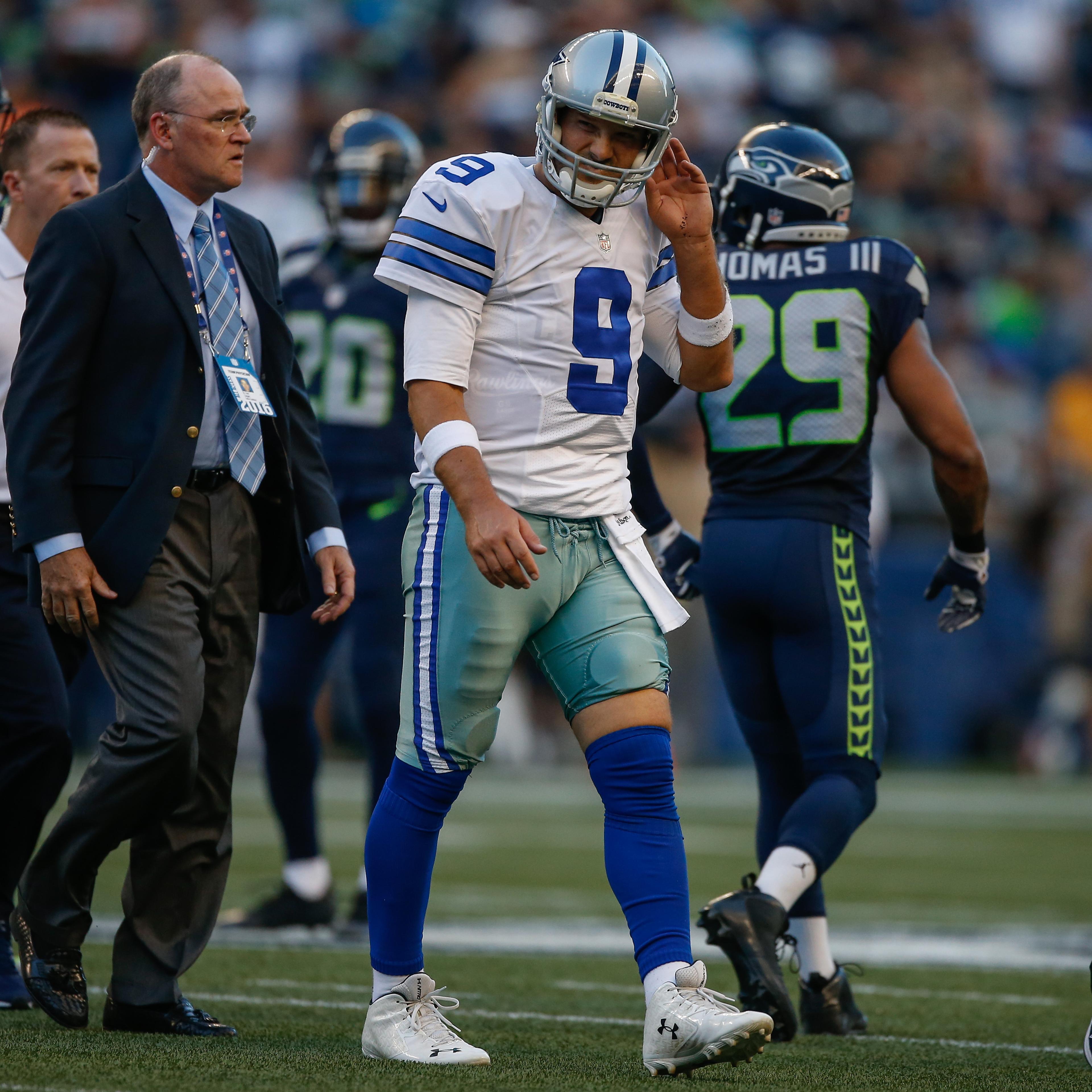 Quarterback Tony Romo of the Dallas Cowboys leaves the field after being injured during a preseason game against the Seattle Seahawks in Seattle, Washington, on Aug. 25, 2016.