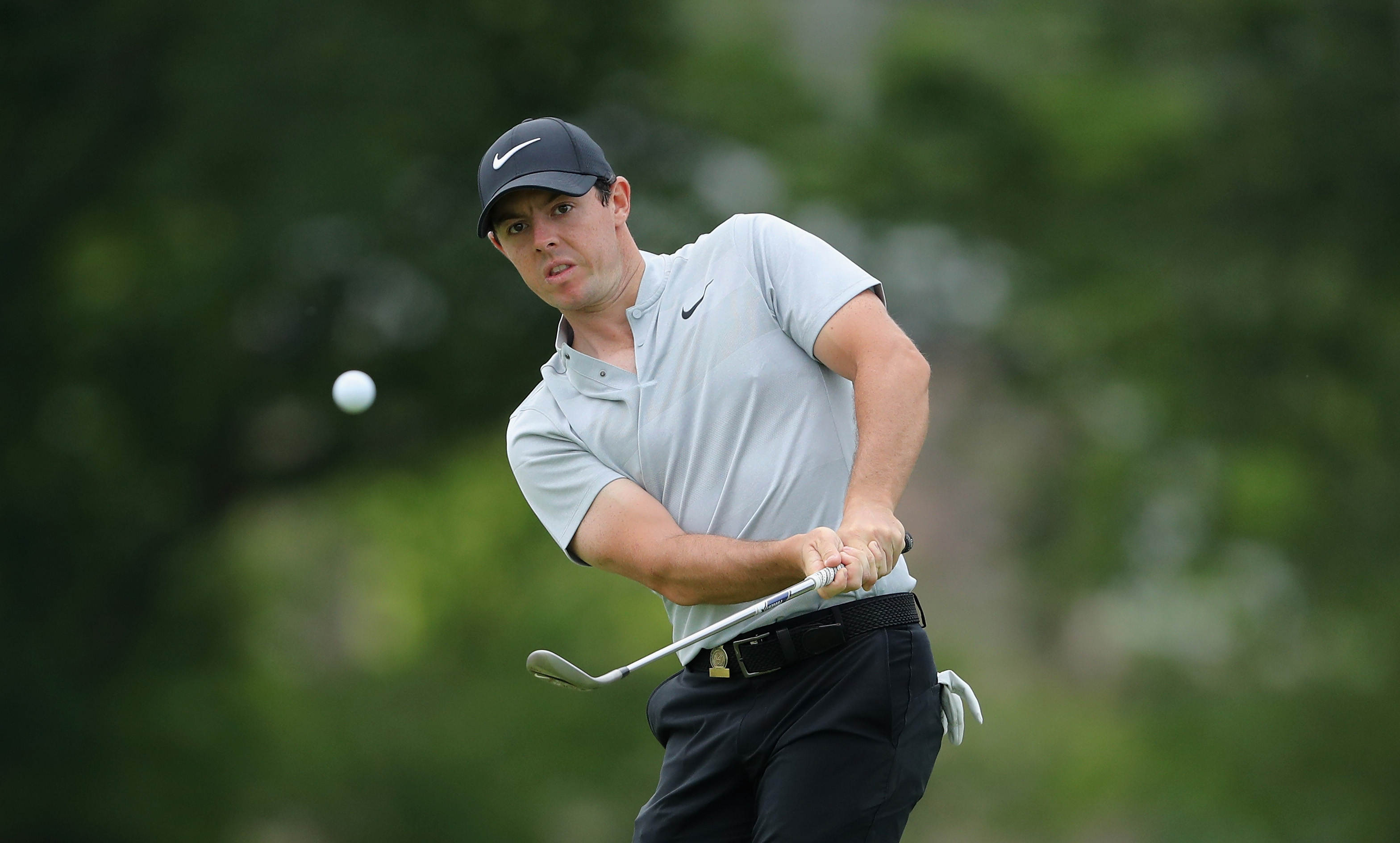 Rory McIlroy of Northern Ireland plays a shot with a wedge on the fourth green during the first round of the U.S. Open at Oakmont Country Club in Oakmont, Pa. on June 16, 2016.