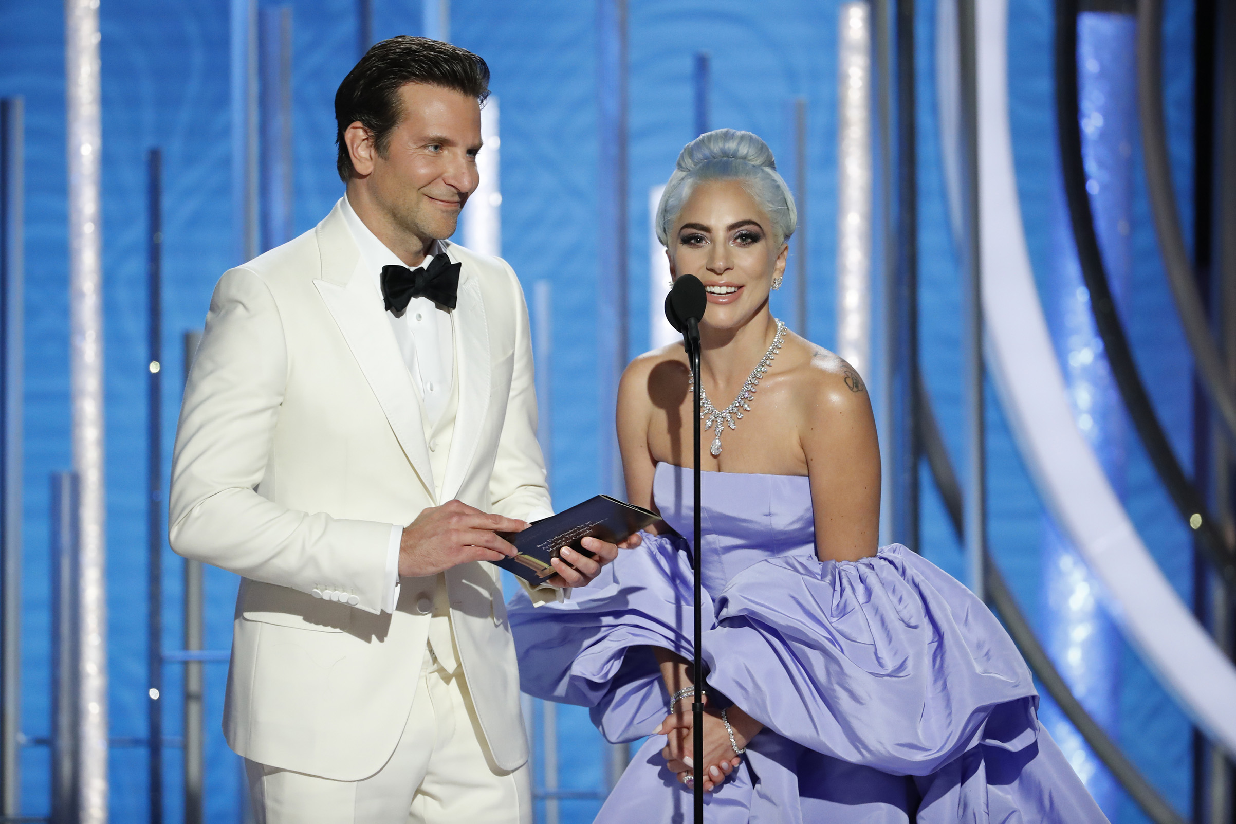 Presenters Bradley Cooper and Lady Gaga speak onstage during the 76th Annual Golden Globe Awards.