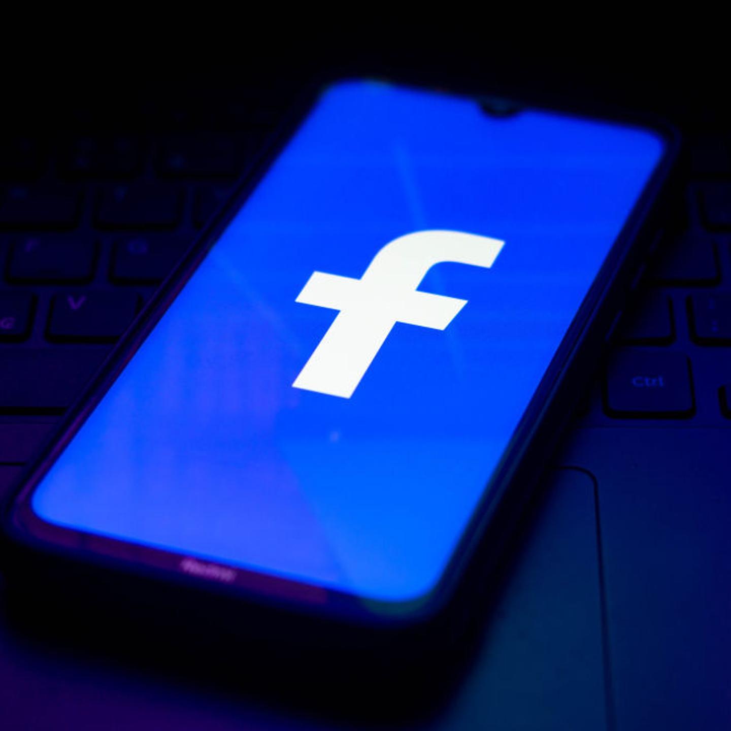 In this photo illustration the Facebook logo seen displayed