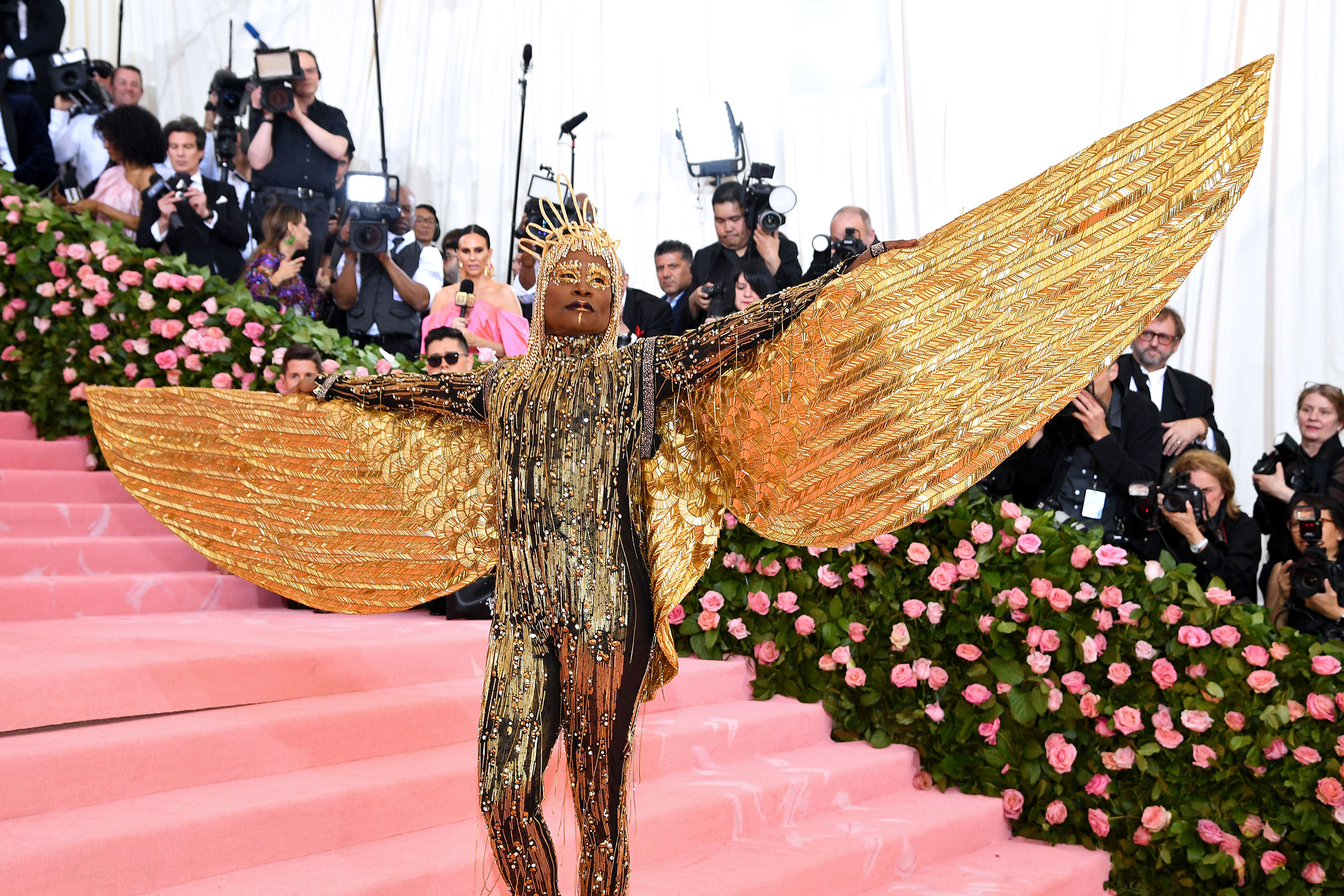 billy porter gold dress Billy Porter shines in 24k gold feathers at Oscars red carpet