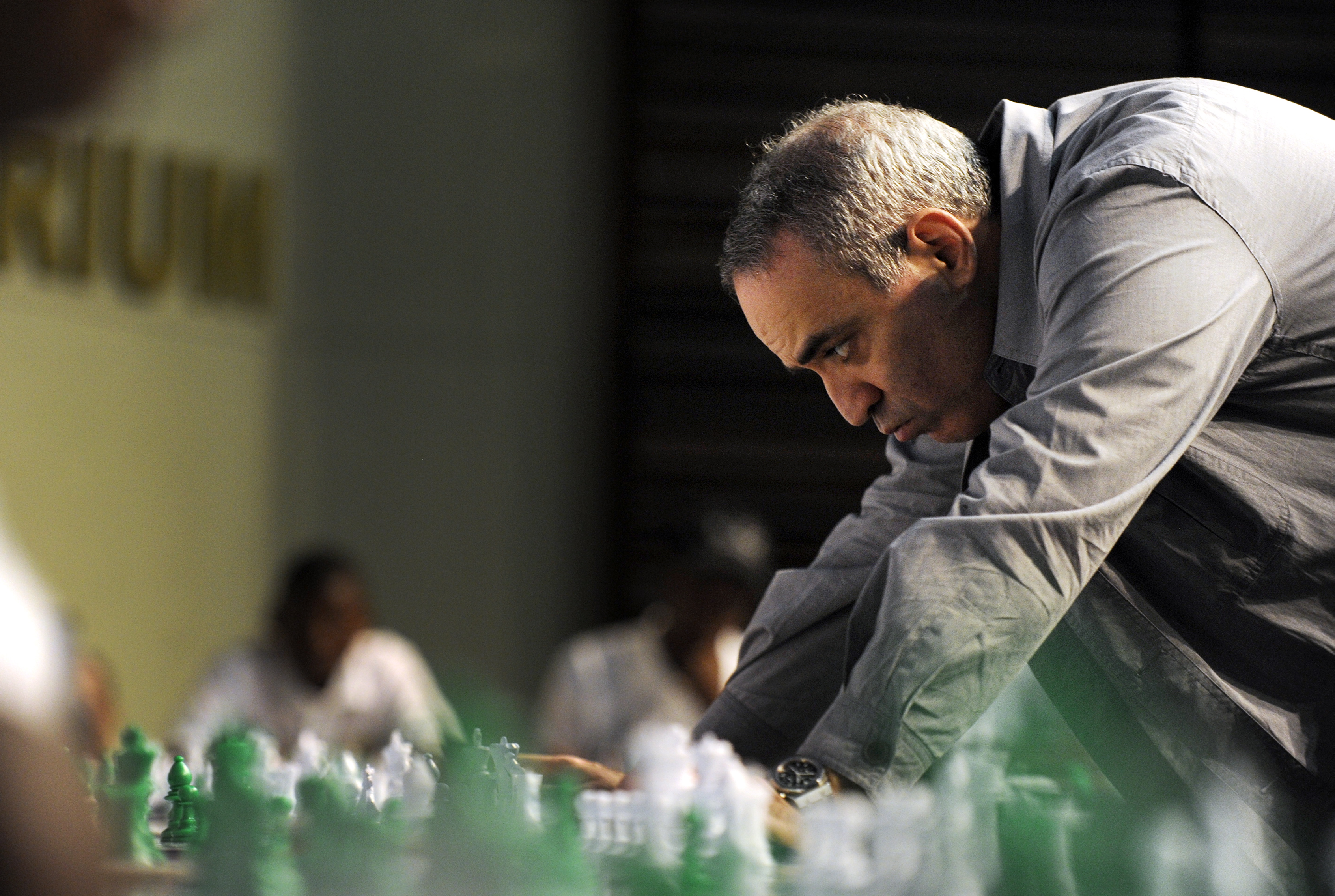 Former World Chess Champion Garry Kasparov plays a game of chess with school children on March 25, 2012 in Pretoria, South Africa.