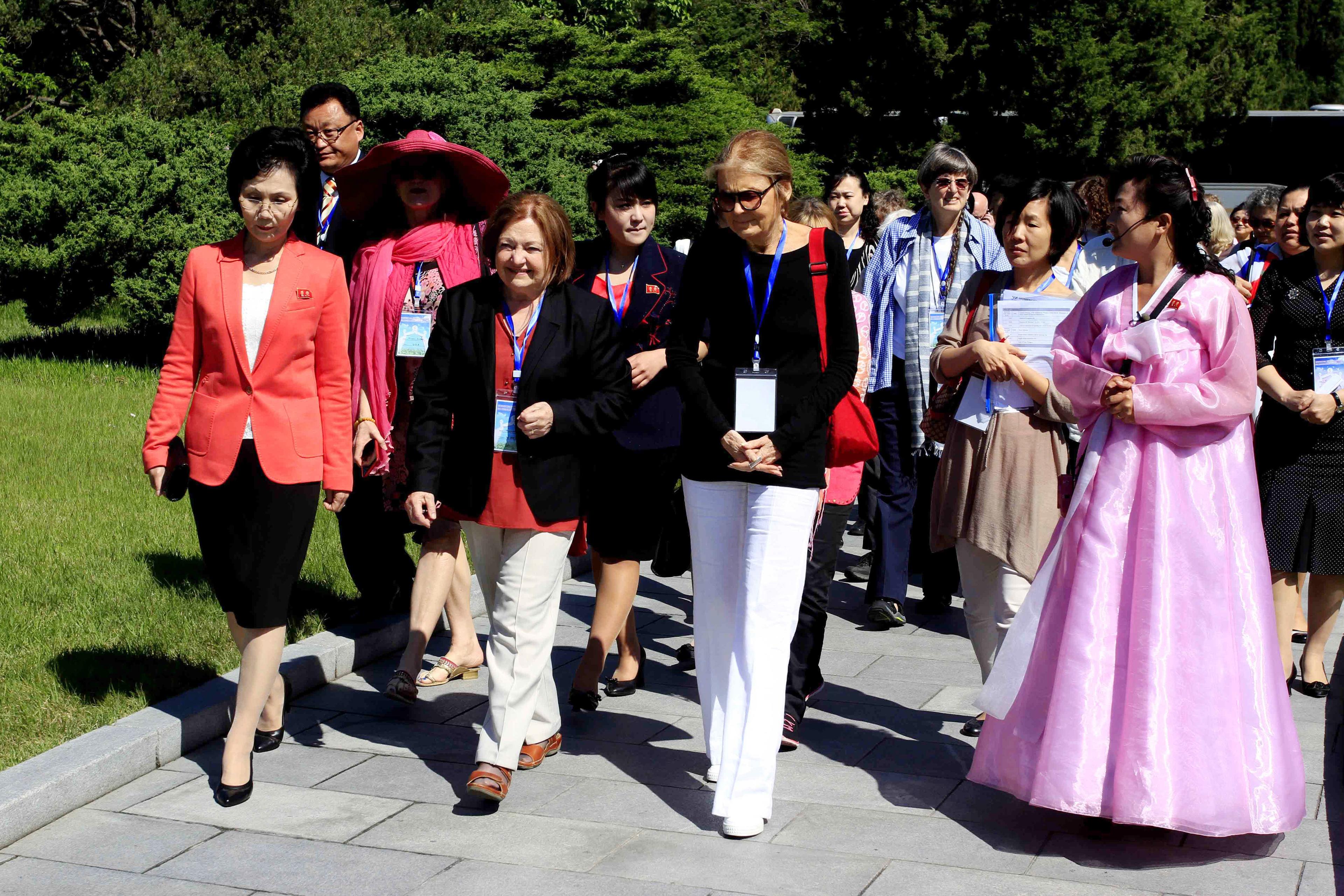 Activist Gloria Steinem, center right, and Nobel Peace Prize laureate Mairead Maguire, center left, along with other delegation, visit Mangyongdae, the birthplace of North Korea's late leader Kim Il Sung, in Pyongyang, Wednesday, May 20, 2015