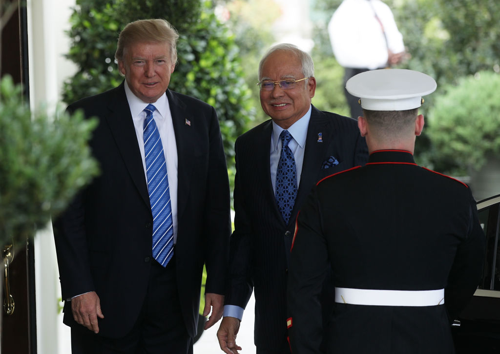 U.S. President Donald Trump welcomes Malaysian Prime Minister Najib Razak outside the West Wing of the White House in Washington, D.C., on Sept. 12, 2017.