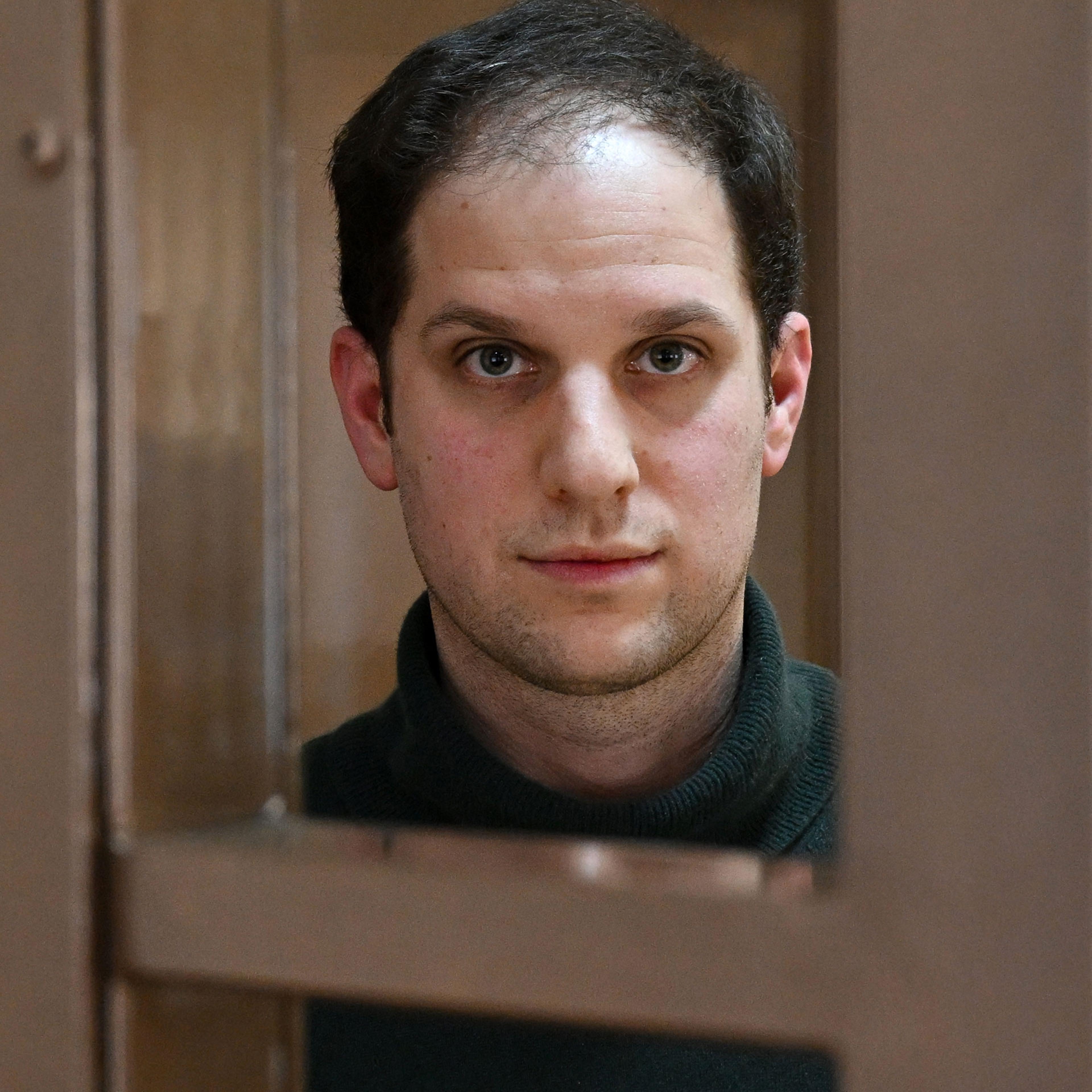 Evan Gershkovich in the defendants’ cage at a pretrial hearing in Moscow on Feb. 20