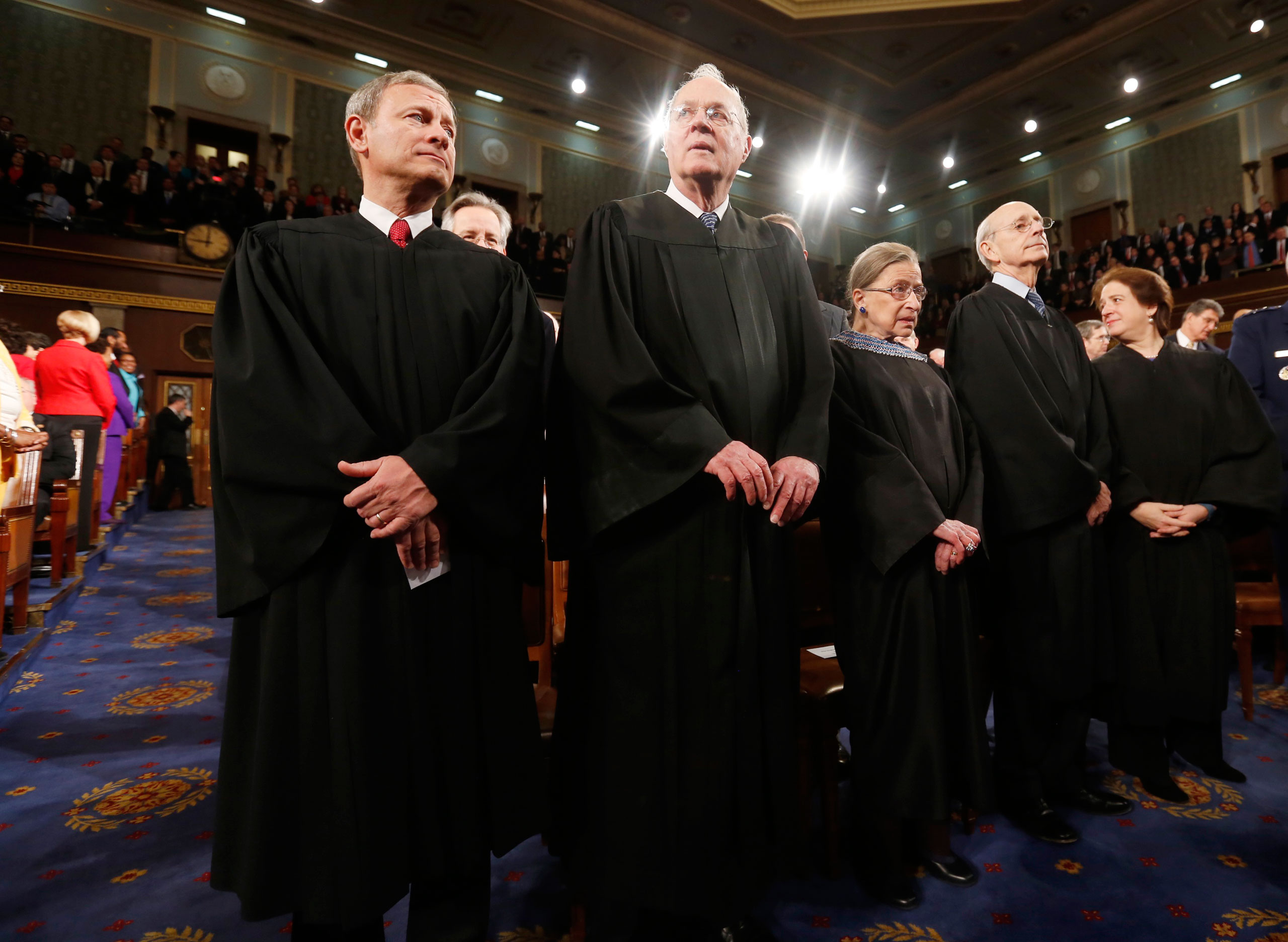 From left: U.S. Supreme Court Chief Justice John Roberts stands with fellow Justices Anthony Kennedy, Ruth Bader Ginsburg, Stephen Breyer and Elena Kagan prior to President Barack Obama's State of the Union speech on Capitol Hill in Washington, D.C. on J