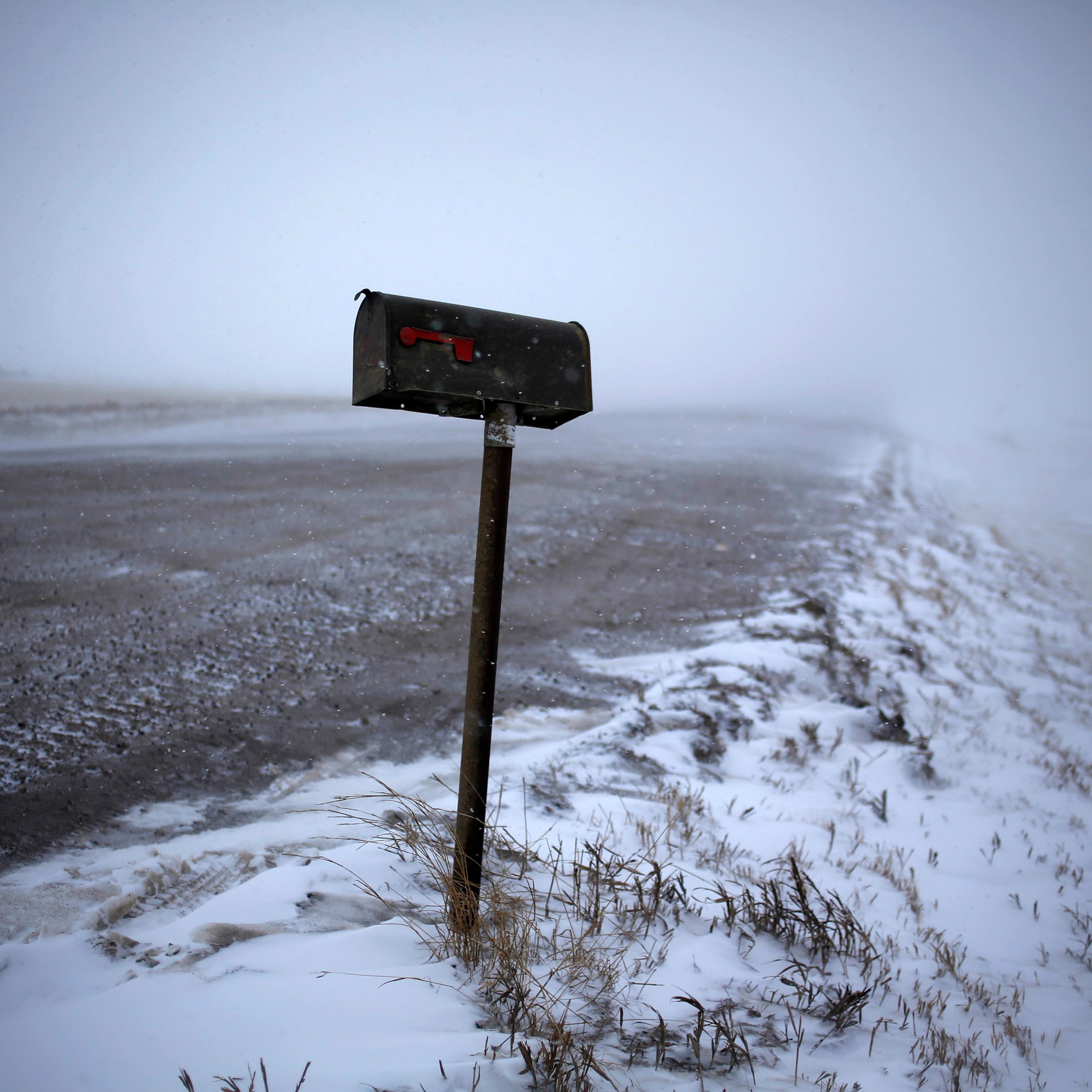 A mailbox is seen along a road during a snowstorm outside of Williston, North Dakota March 11, 2013.