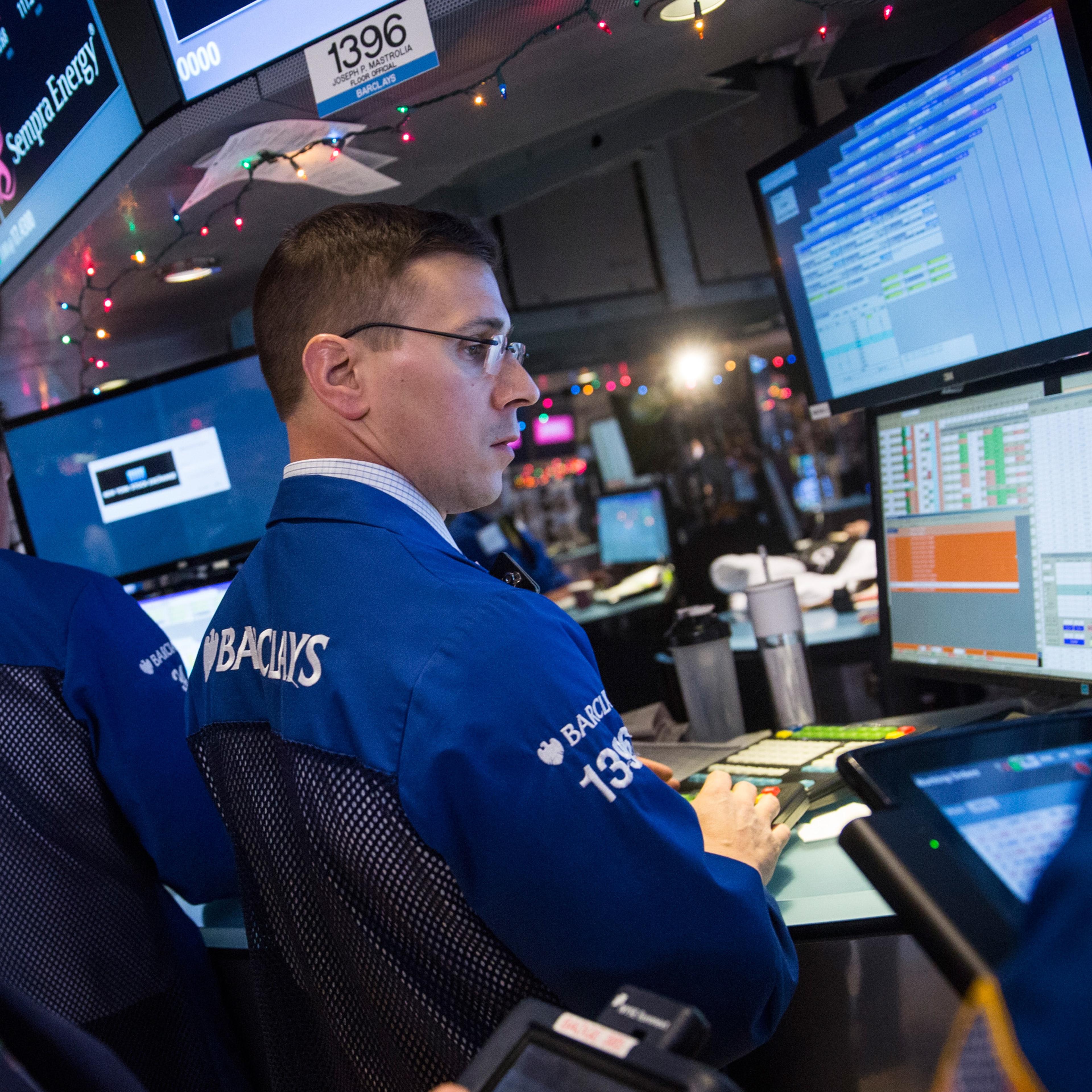 Traders work on the floor of the New York Stock Exchange.