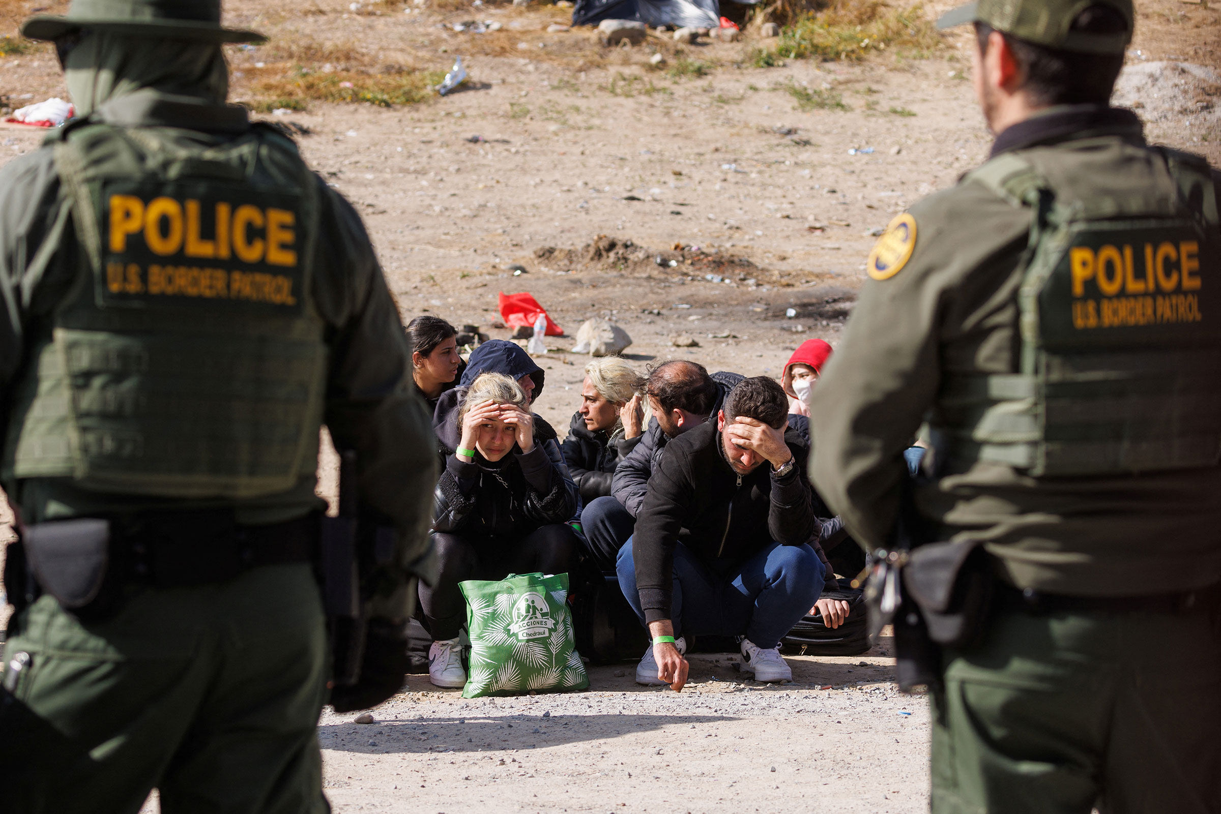 U.S. Border Patrol organize migrants after they gathered between primary and secondary border fences as the United States prepares to lift COVID-19 era Title 42 restrictions that have blocked migrants at the U.S.-Mexico border from seeking asylum since 2