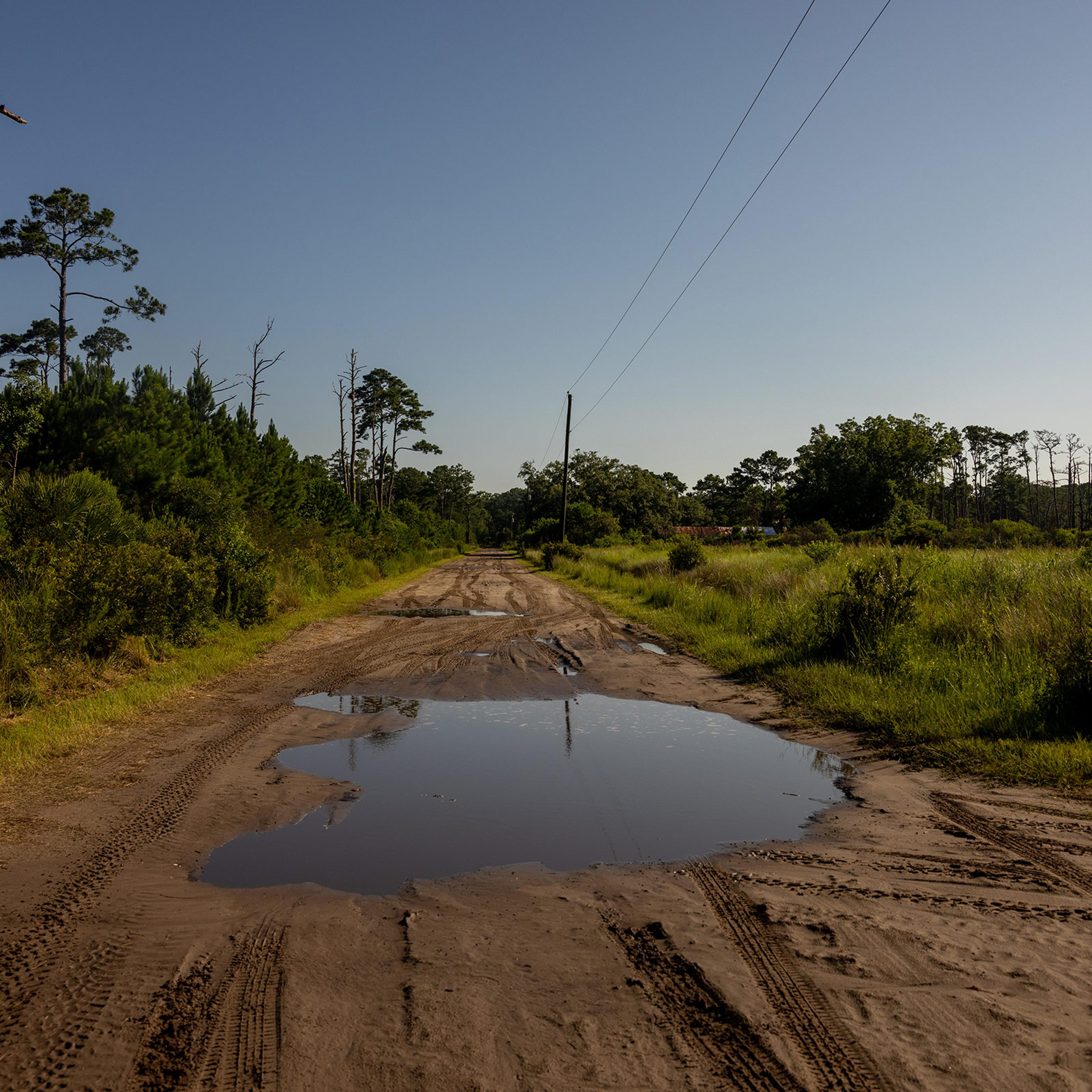 Dirt roads filled with water are spread around the island.