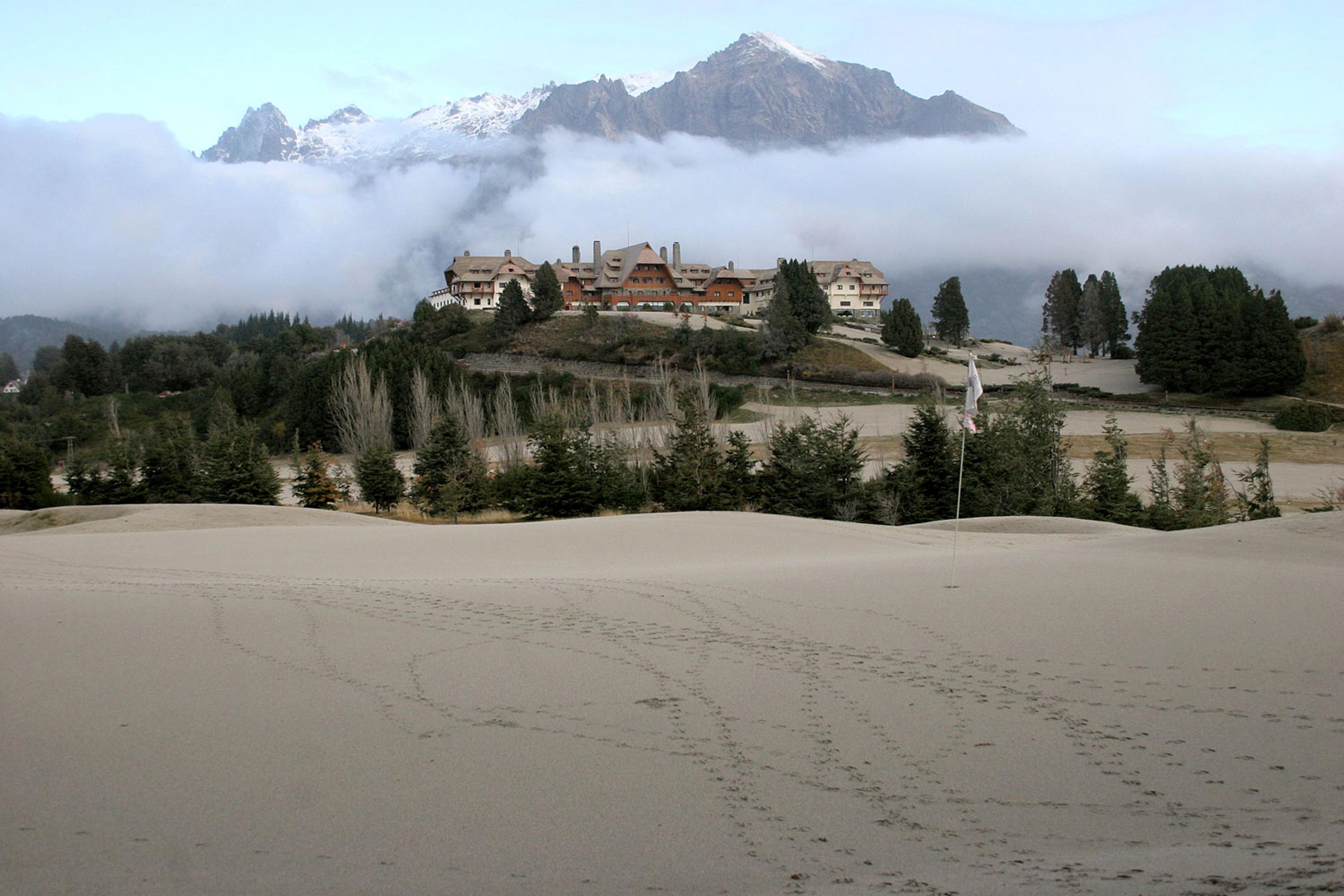 A view of the 9th hole green covered in ash at the Llao Llao hotel golf course in Bariloche, Argentina.