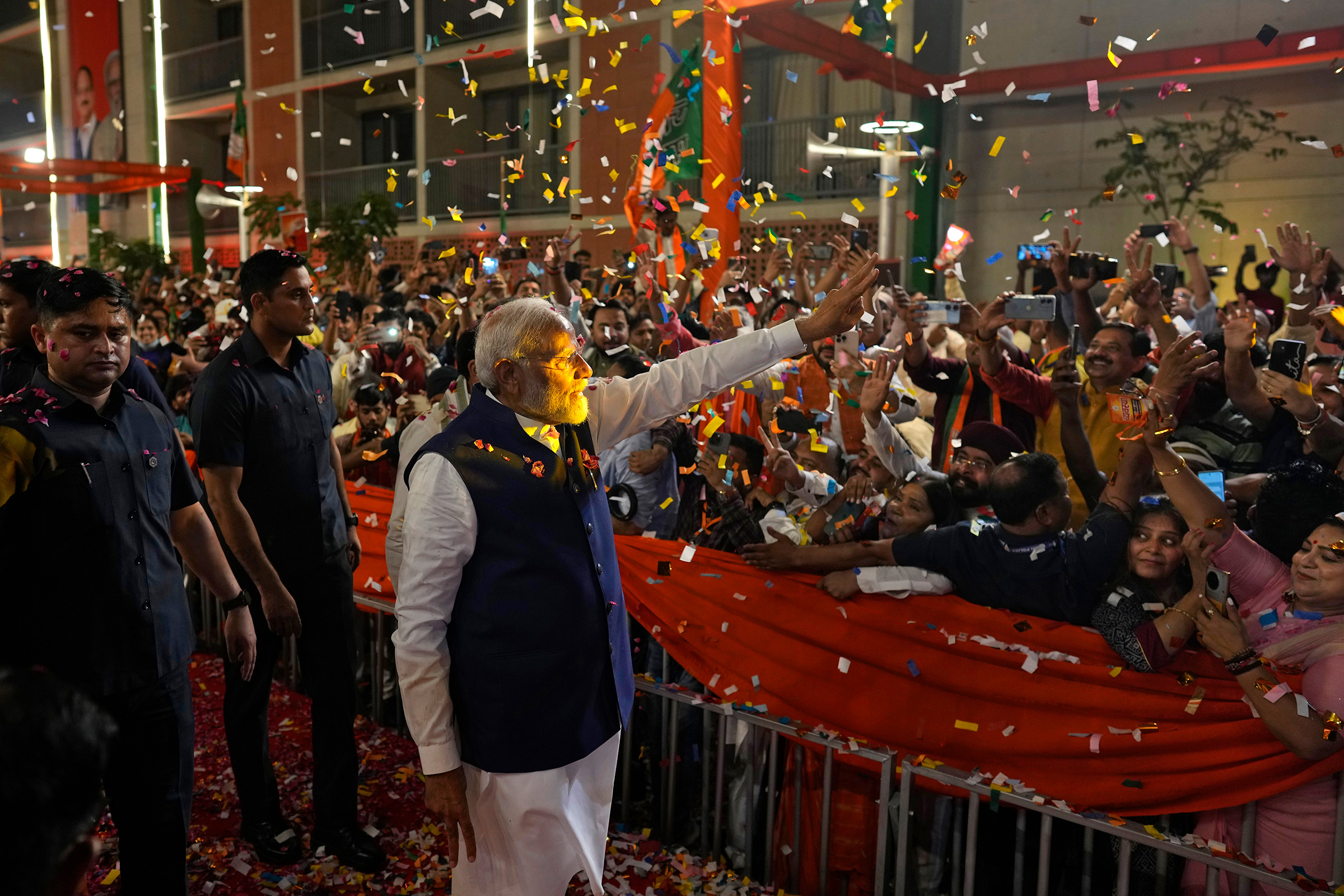 Prime Minister Narendra Modi is greeted by supporters as he arrives at Bharatiya Janata Party (BJP) headquarters in New Delhi on June 4, 2024.