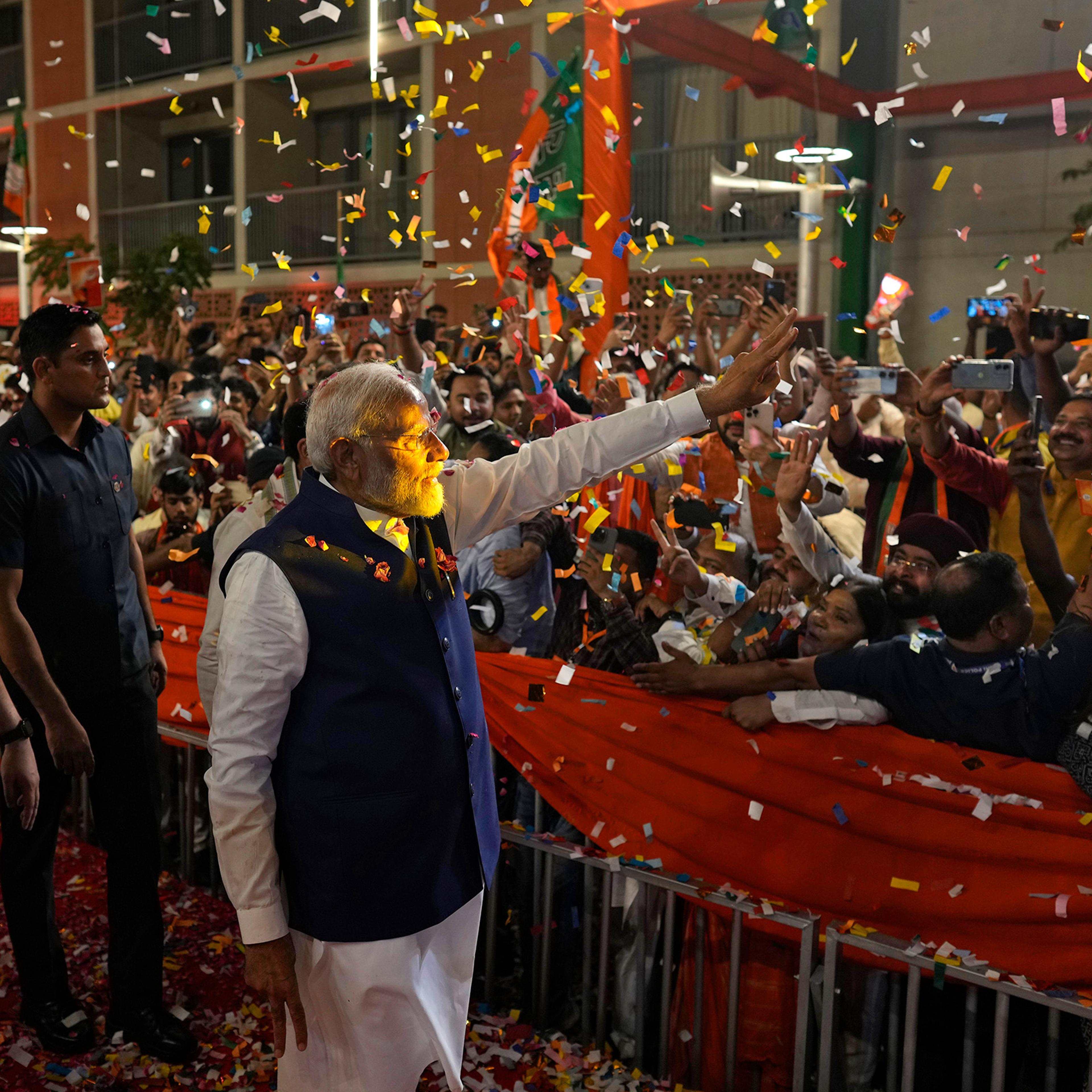 Prime Minister Narendra Modi is greeted by supporters as he arrives at Bharatiya Janata Party (BJP) headquarters in New Delhi on June 4, 2024.