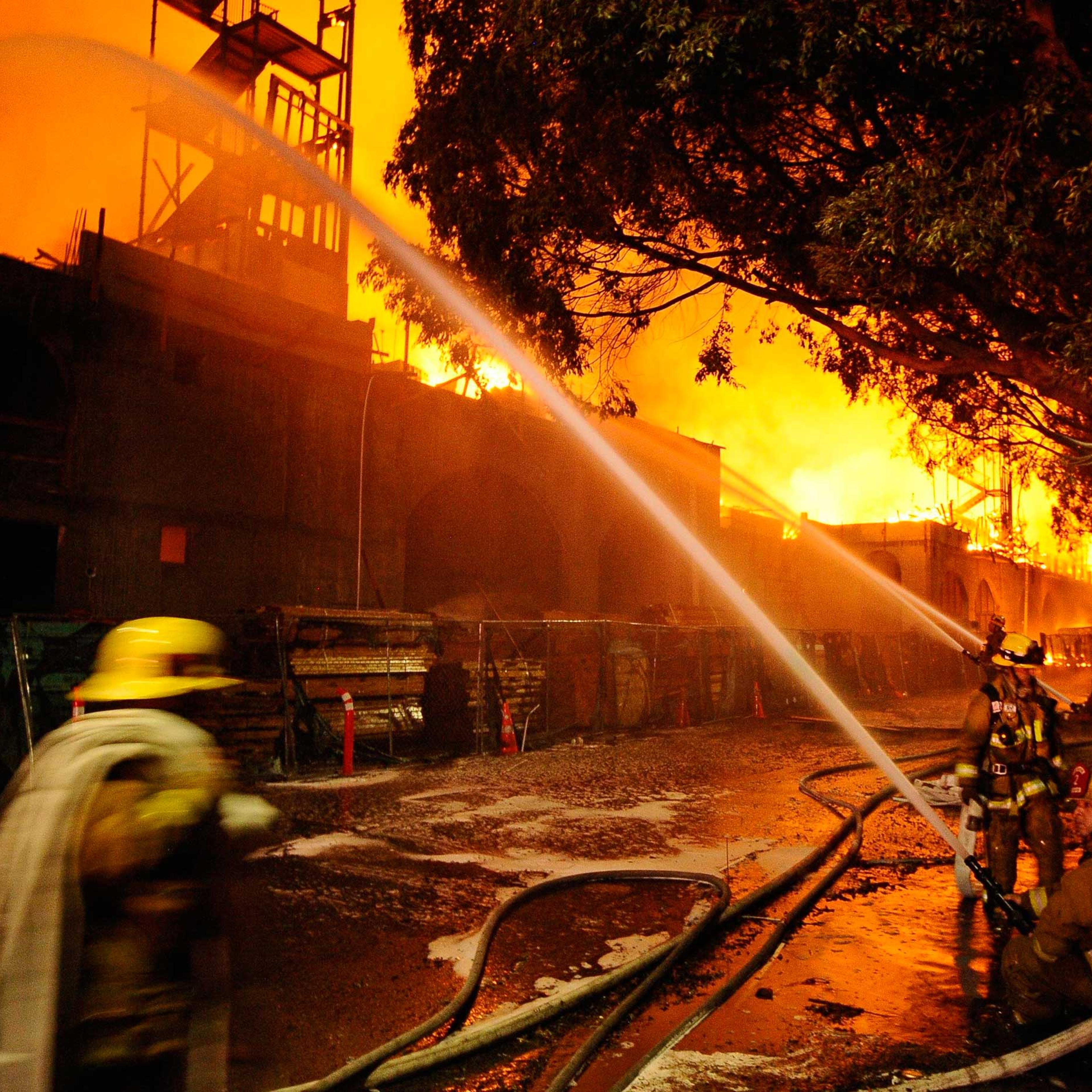Los Angeles city firefighters battle a massive fire at a seven-story downtown apartment complex under construction in Los Angeles