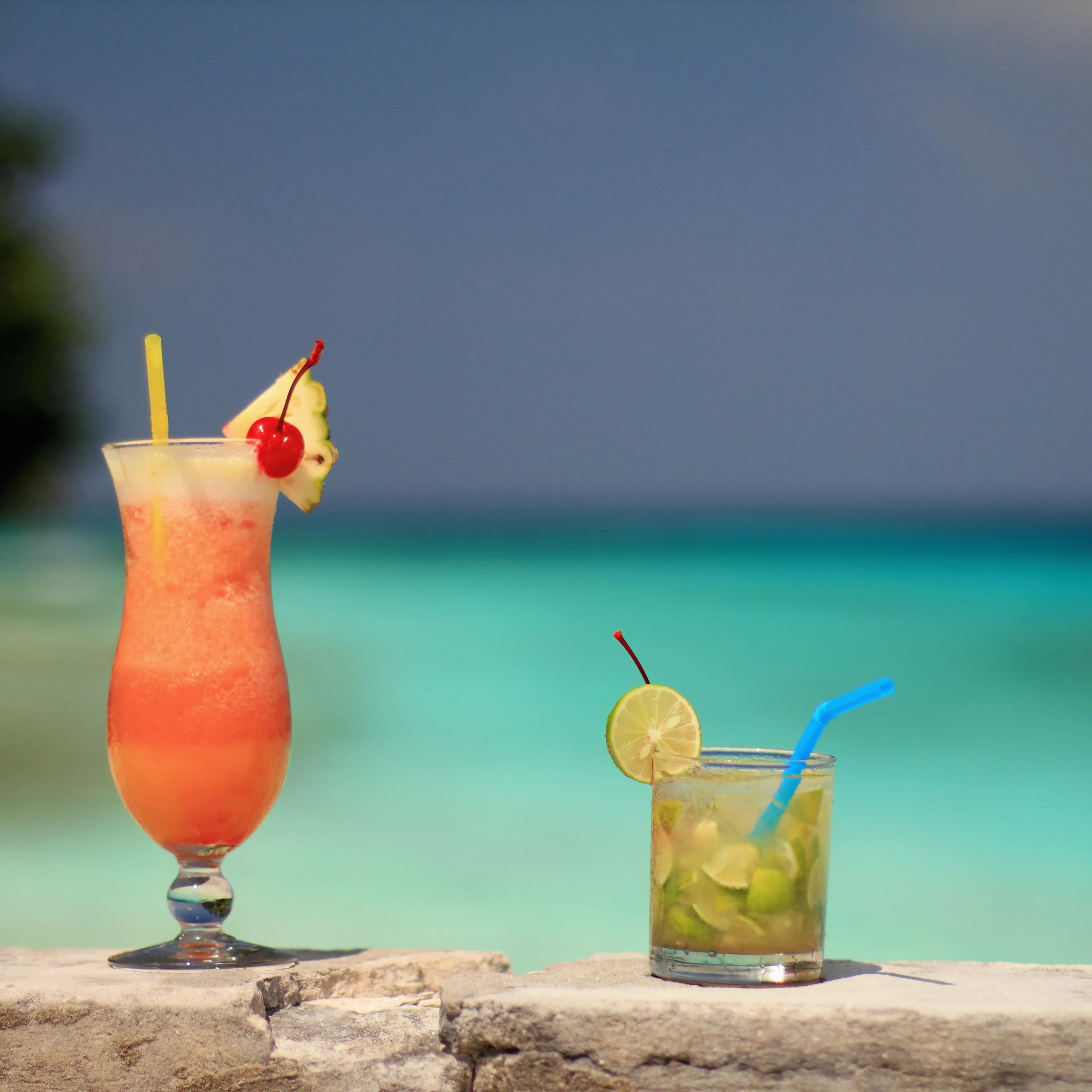 Tropical drinks on rock wall