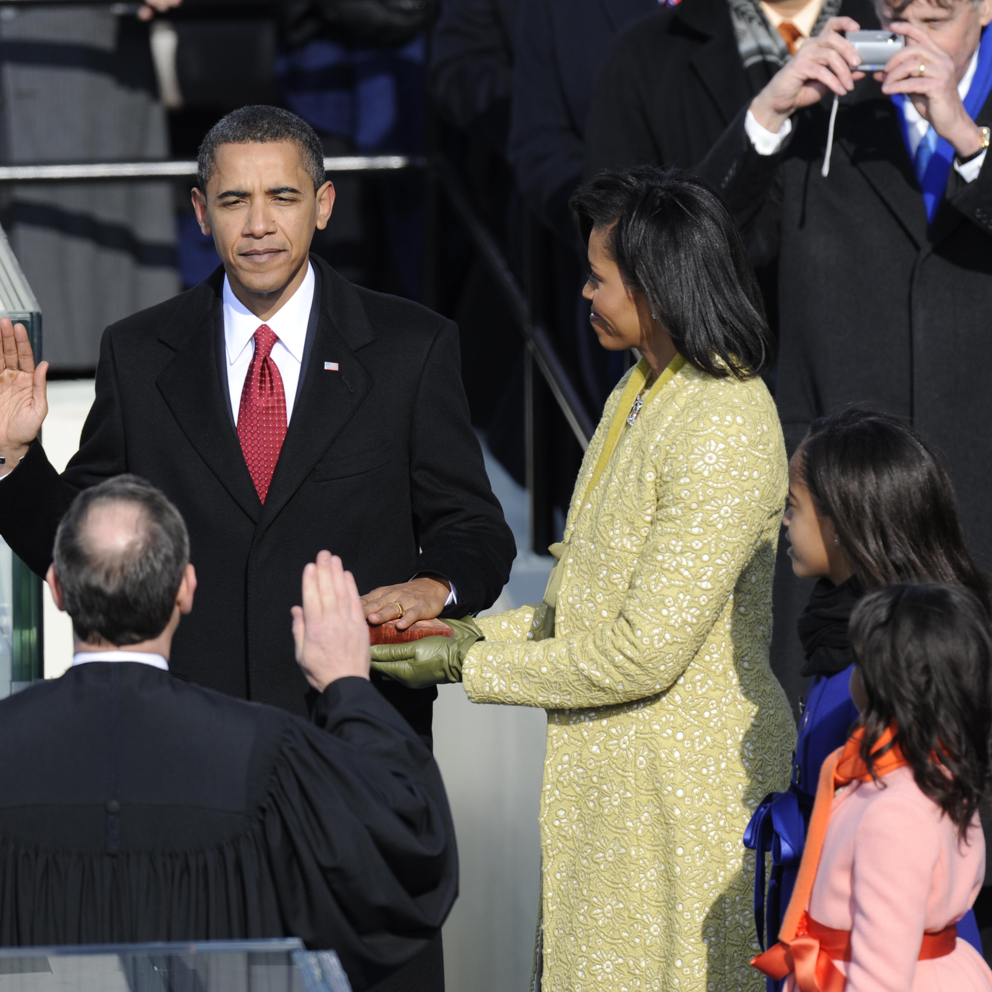 President Elect, Barack Obama, takes the Oath of Office from Chief Justice, Roberts as his wife, Michelle, and his daughters, Malia, and Sasha, far right, during the Presidential Inauguration at the U.S. Capitol Tuesday afternoon.