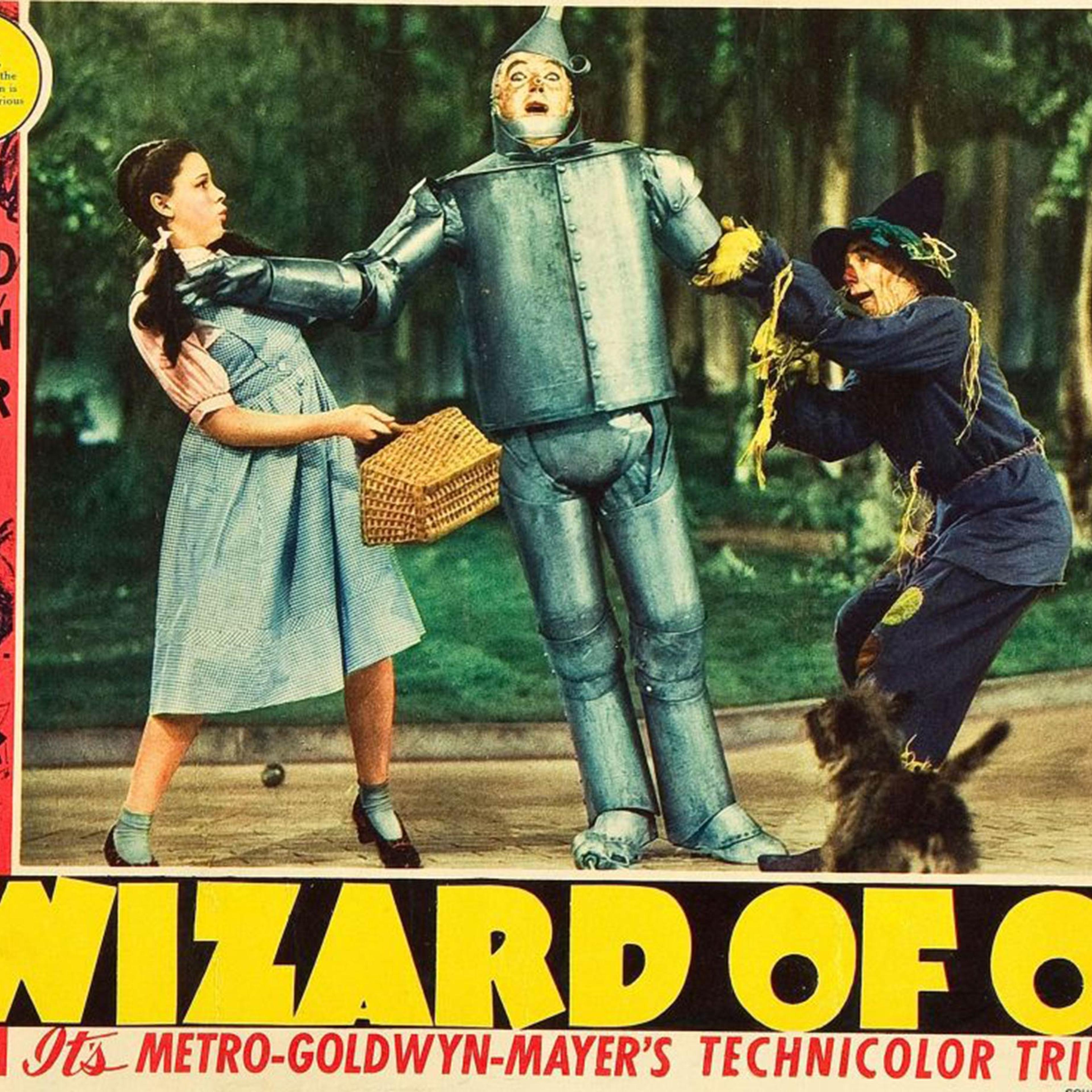 A 1939 publicity poster for <i>The Wizard Of Oz</i> for display in the lobby of movie theaters. Pictured, from left: Judy Garland, Jack Haley, Ray Bolger; bottom: Toto.