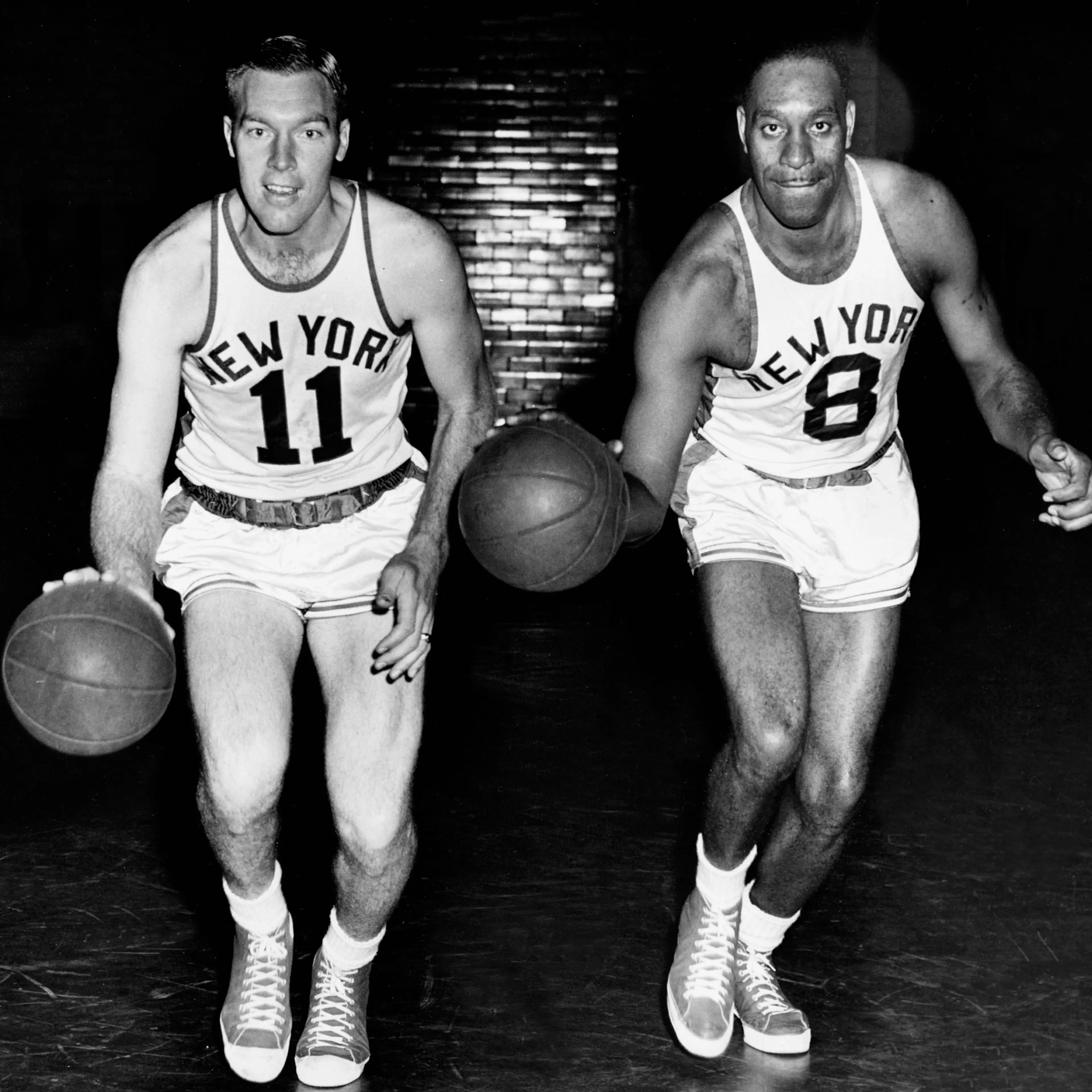 Harry Gallatin #11 and Nathaniel Clifton #8 of the New York Knicks pose for portrait circa 1950 in New York, New York.