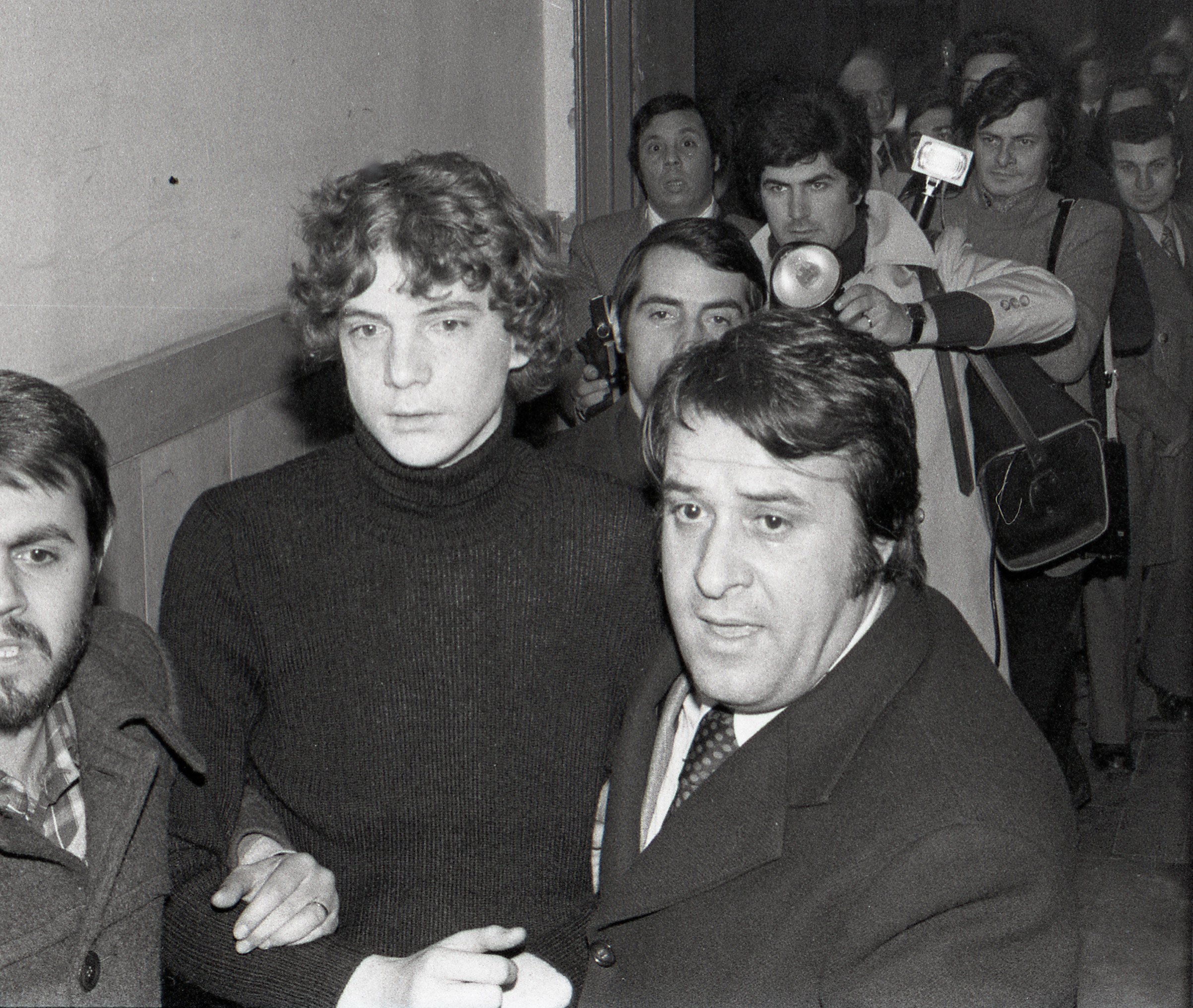 John Paul Getty III is escorted by police as he arrives at Rome's Police Headquarters on Dec. 15, 1973, the day he was freed.