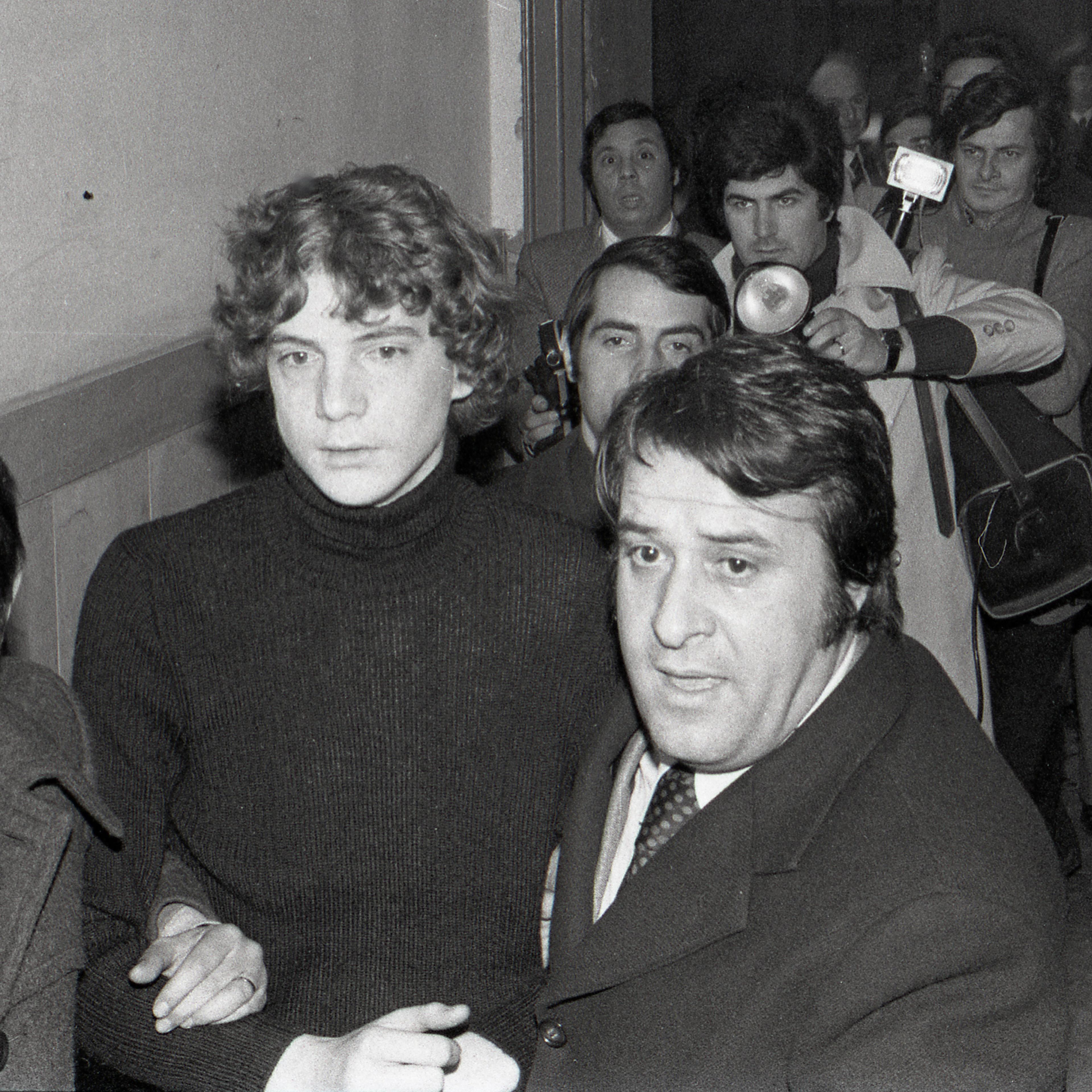 John Paul Getty III is escorted by police as he arrives at Rome's Police Headquarters on Dec. 15, 1973, the day he was freed.