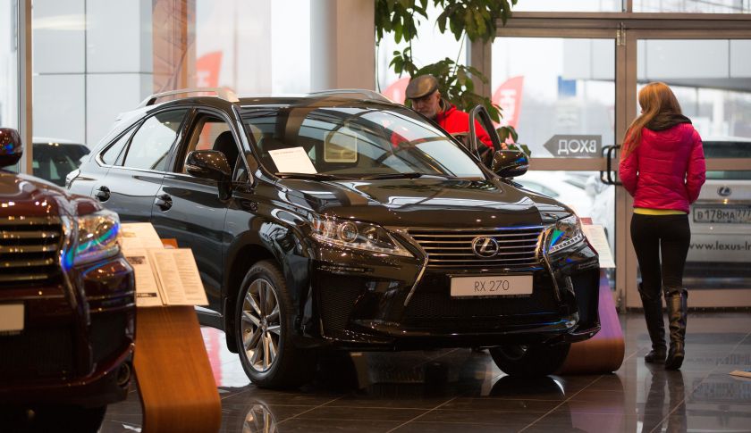 A customer checks out the interior of a Lexus RX270 vehicle for sale inside a Lexus automobile dealership, a unit of Toyota Motor Corp., in Moscow, Russia, on Tuesday, Dec. 16, 2014. Surging borrowing costs pile pressure on the economy of the world's big