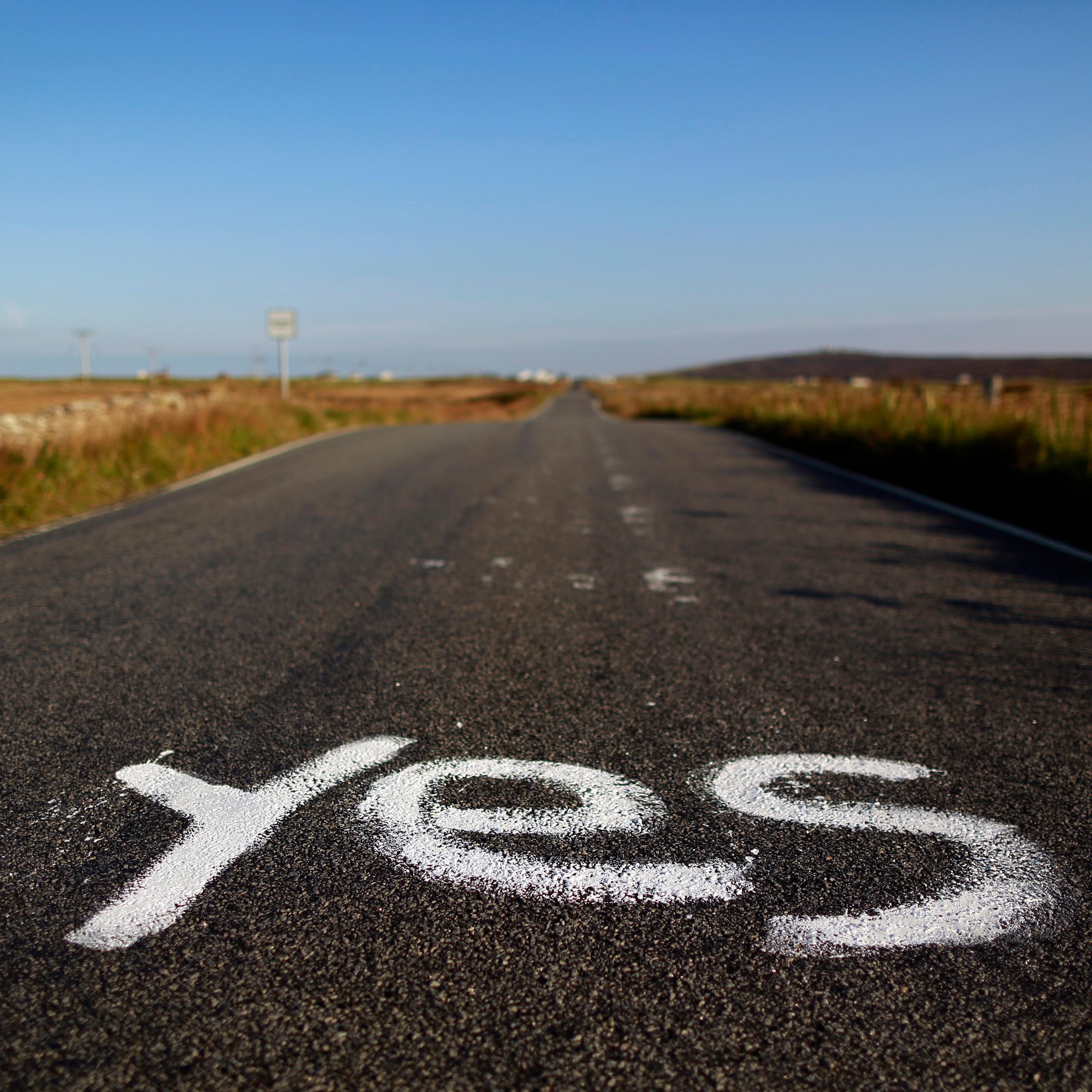 Graffiti supporting the "Yes" campaign is painted on a road in North Uist in the Outer Hebrides