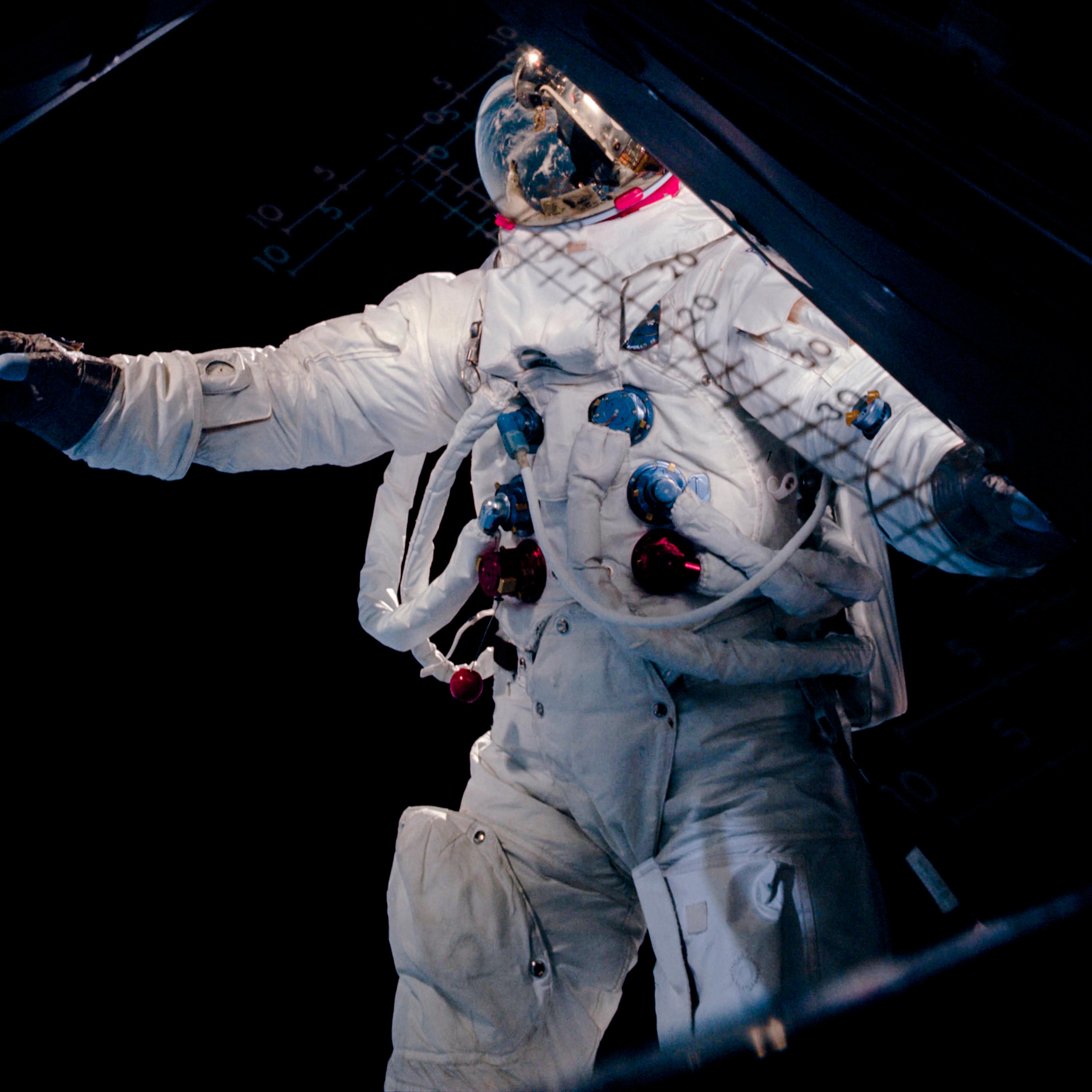 Rusty Schweickart, during a spacewalk in Earth orbit. Here, Schweickart may be trying to regain his balance by pinwheeling his arm forward. The result, however, gave him the look more of a man in full stride.