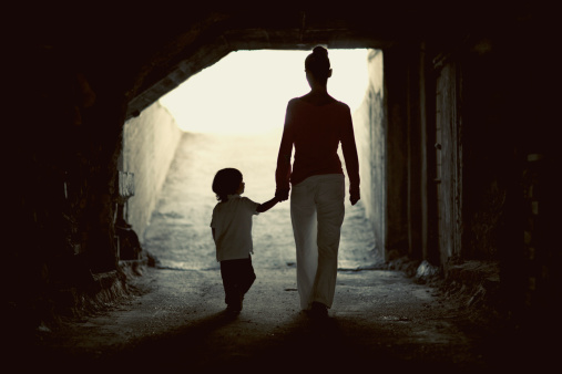 mother-son-holding-hands-walking