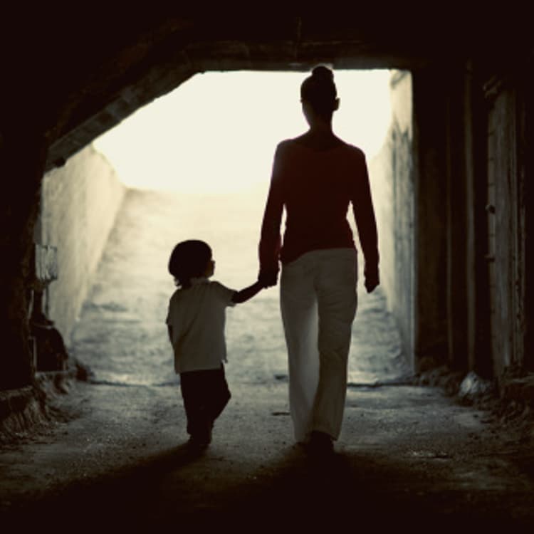 mother-son-holding-hands-walking