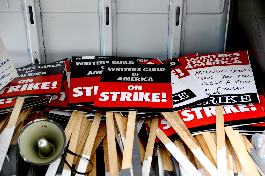 Writers' strike: Hollywood scribes picket studios for better pay. 'It's not sustainable'