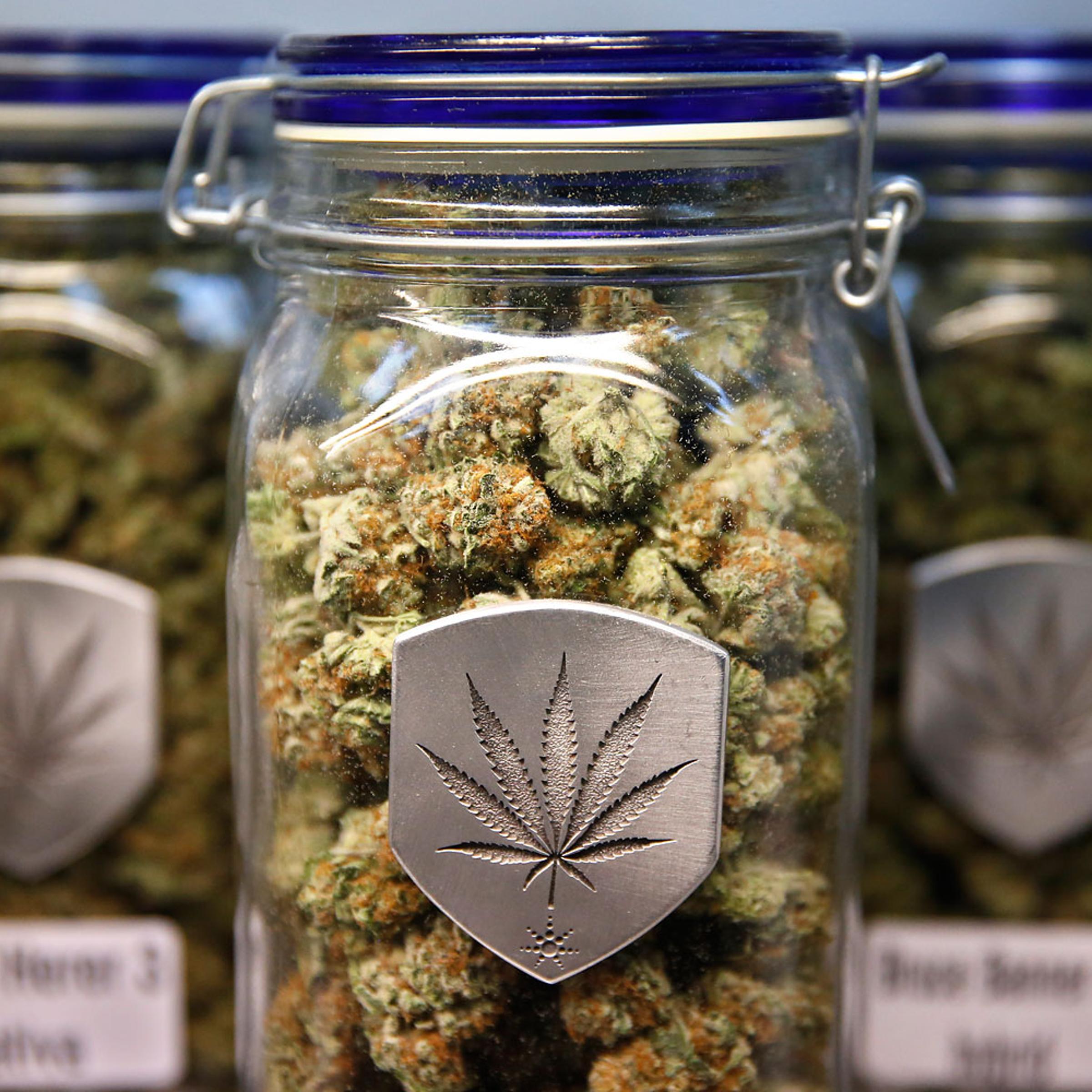 Different strains of pot are displayed for sale at Medicine Man marijuana dispensary in Denver on Dec. 27, 2013.