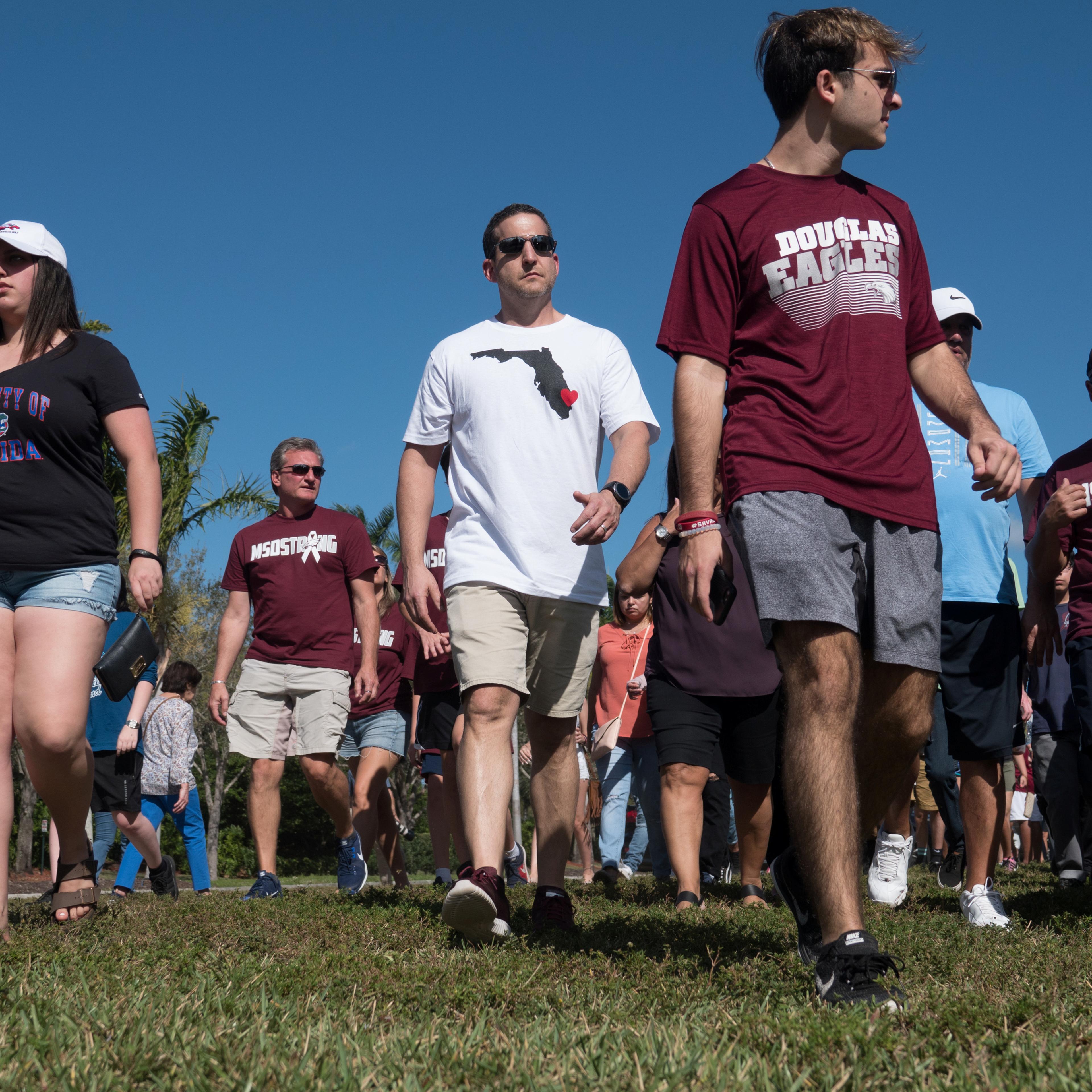 Students and parents arrive for campus orientation at Marjory Stoneman Douglas High in Parkland