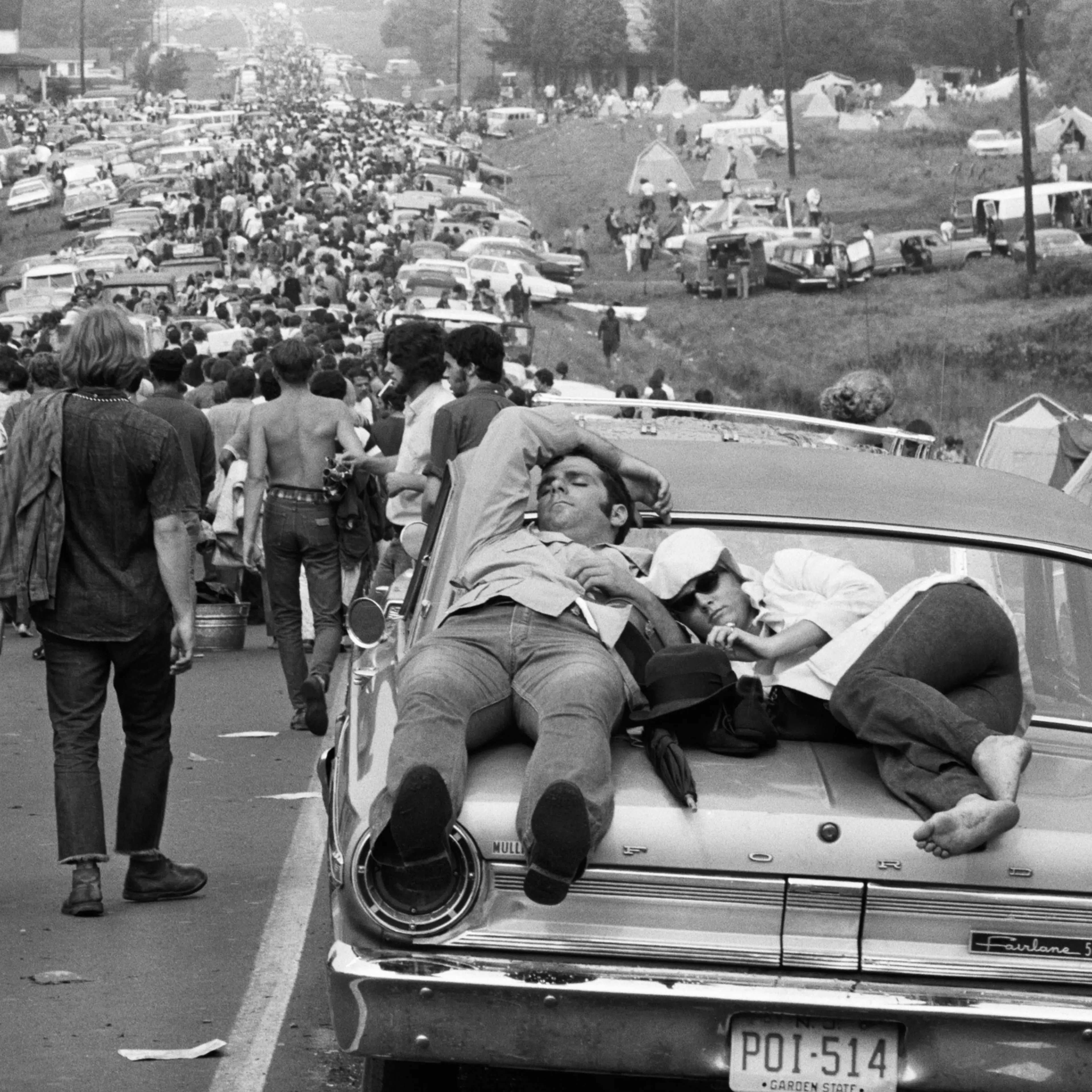 Couple Sleeping on Car at Woodstock, 1969