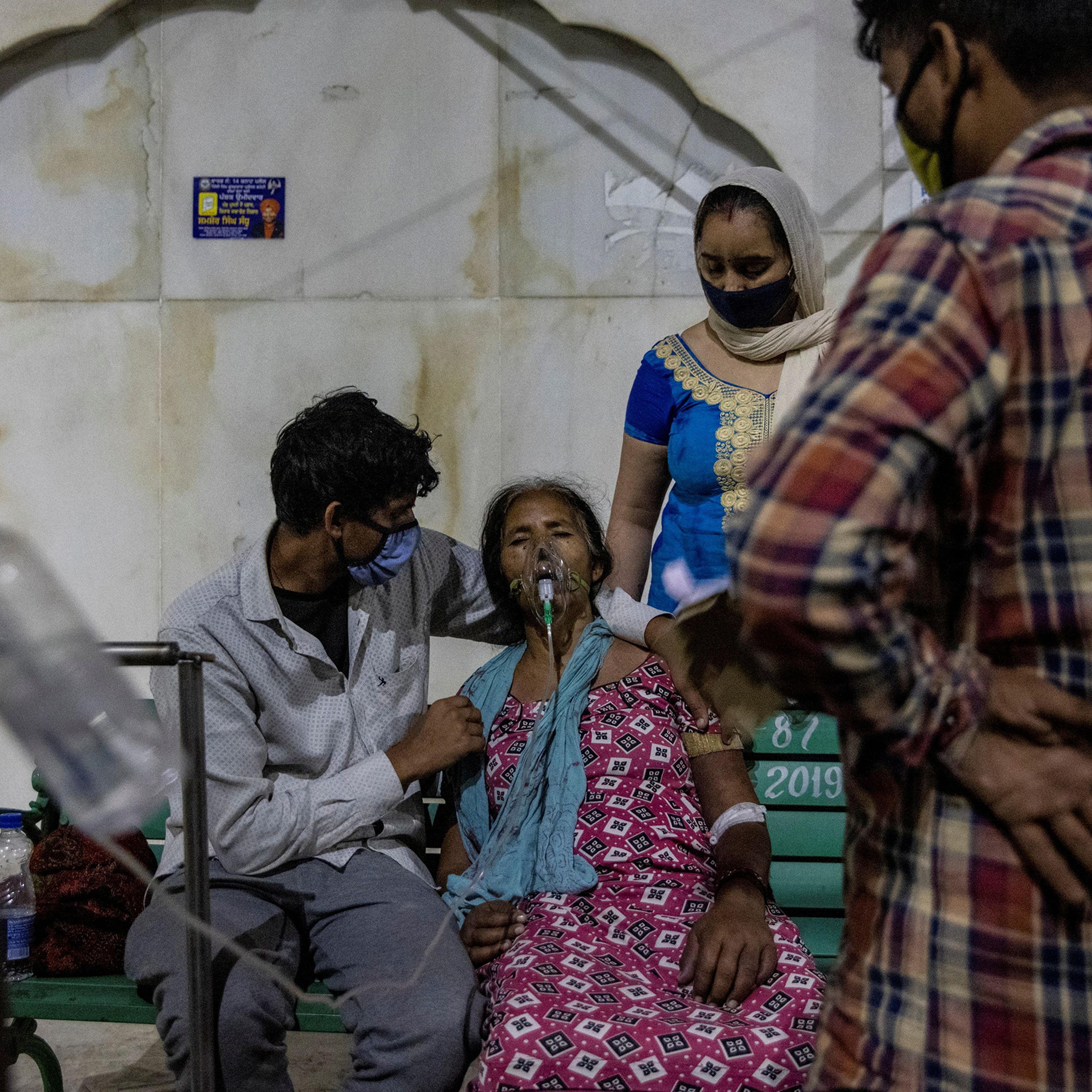 A woman receives free oxygen support at a Sikh temple in Ghaziabad, India, on April 24, 2021.