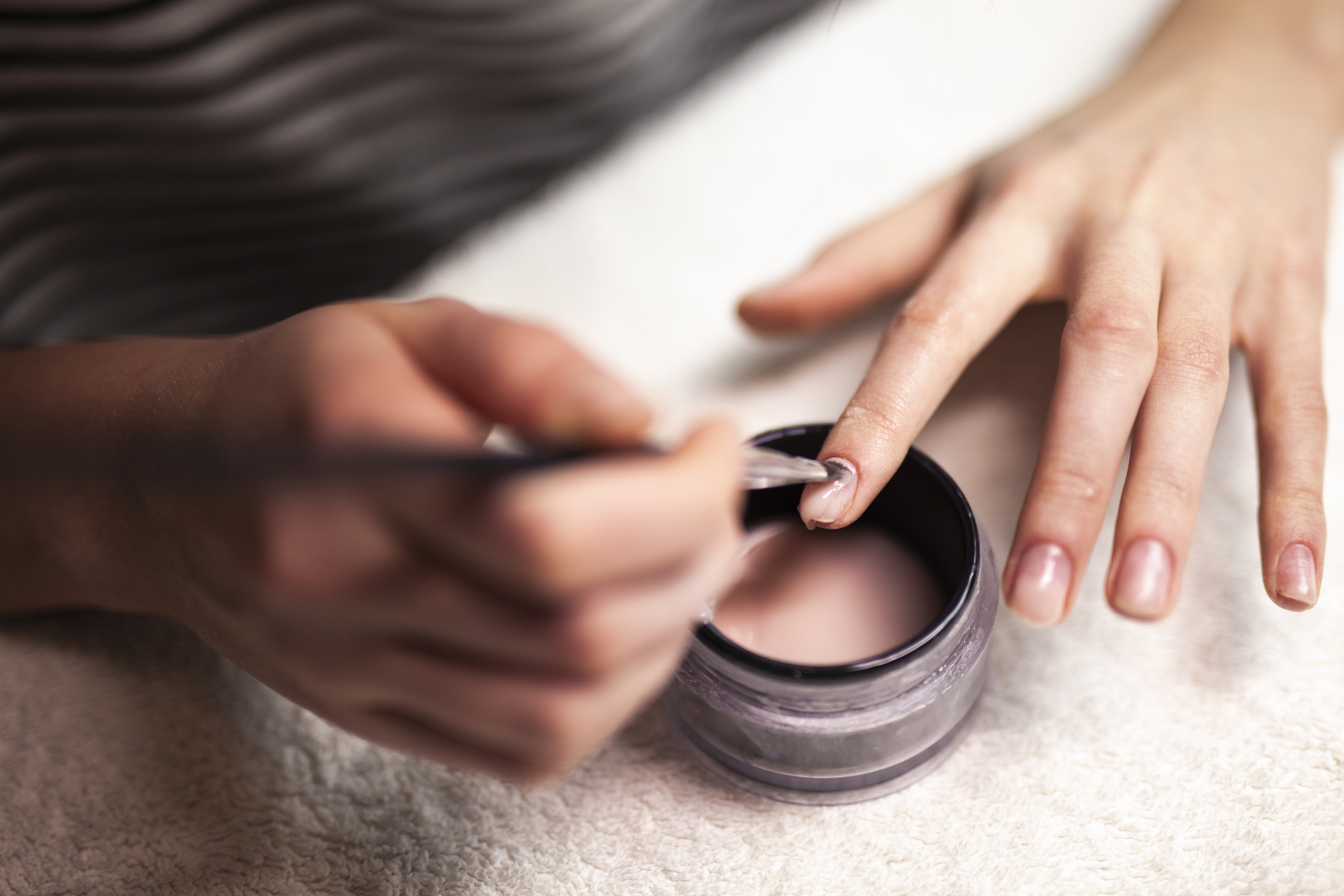 Woman Doing Gel/Acrylic Nails On herself