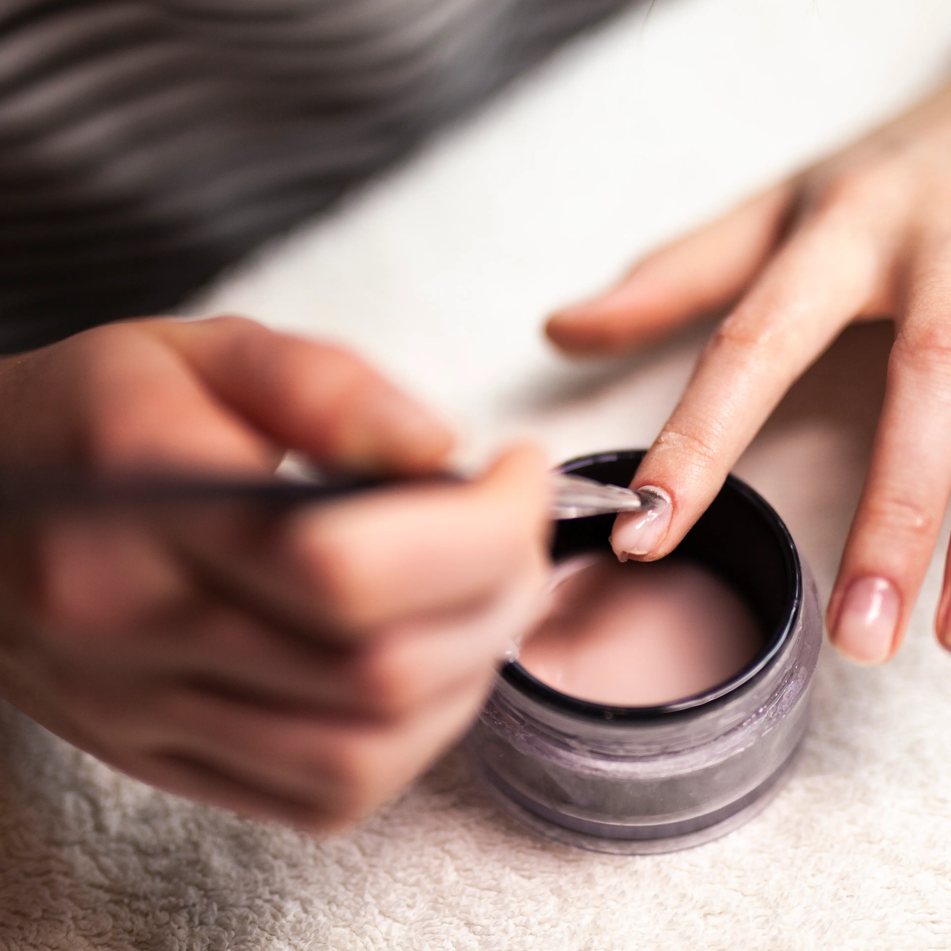 Woman Doing Gel/Acrylic Nails On herself