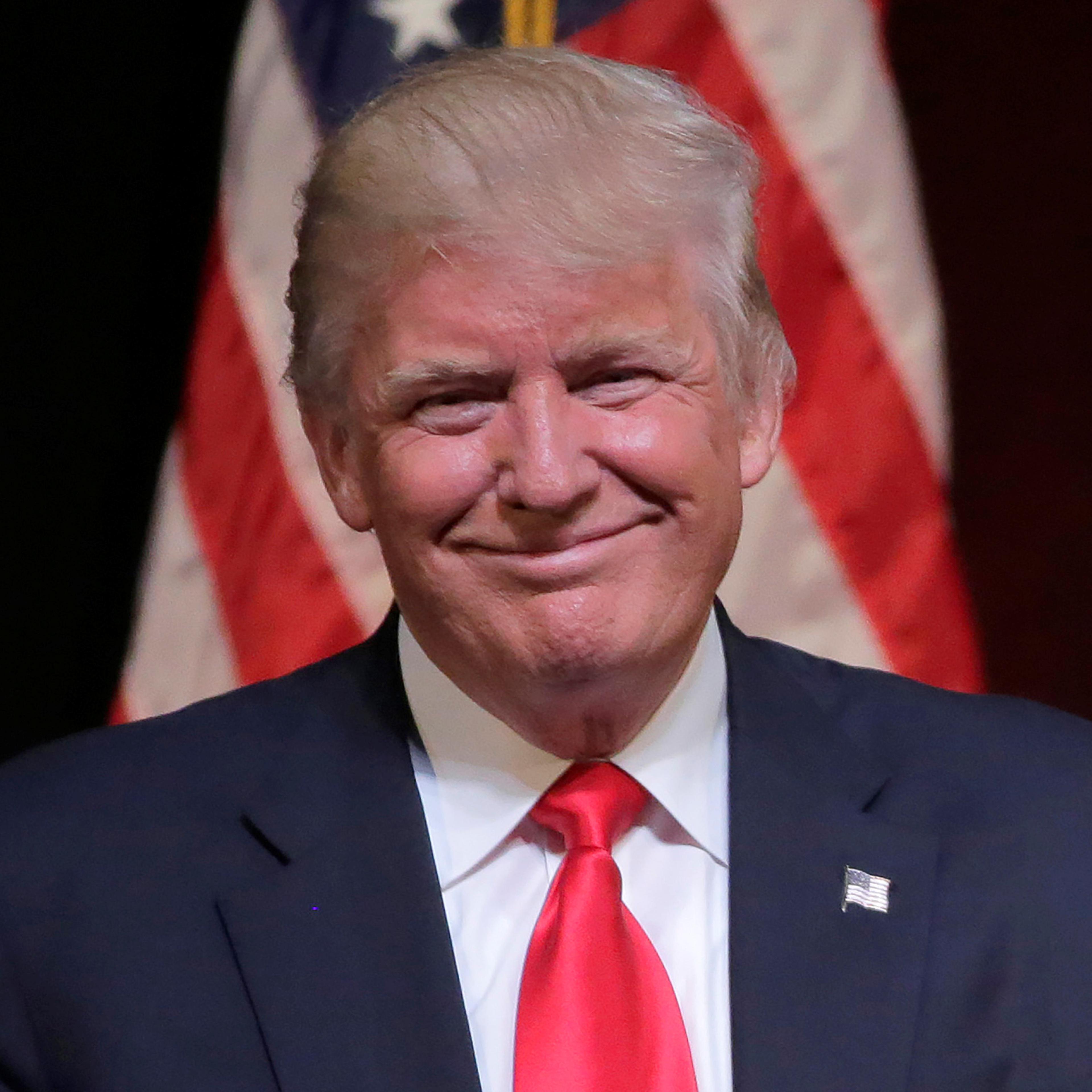 Republican U.S. presidential candidate Donald Trump smiles at a campaign rally in Raleigh.