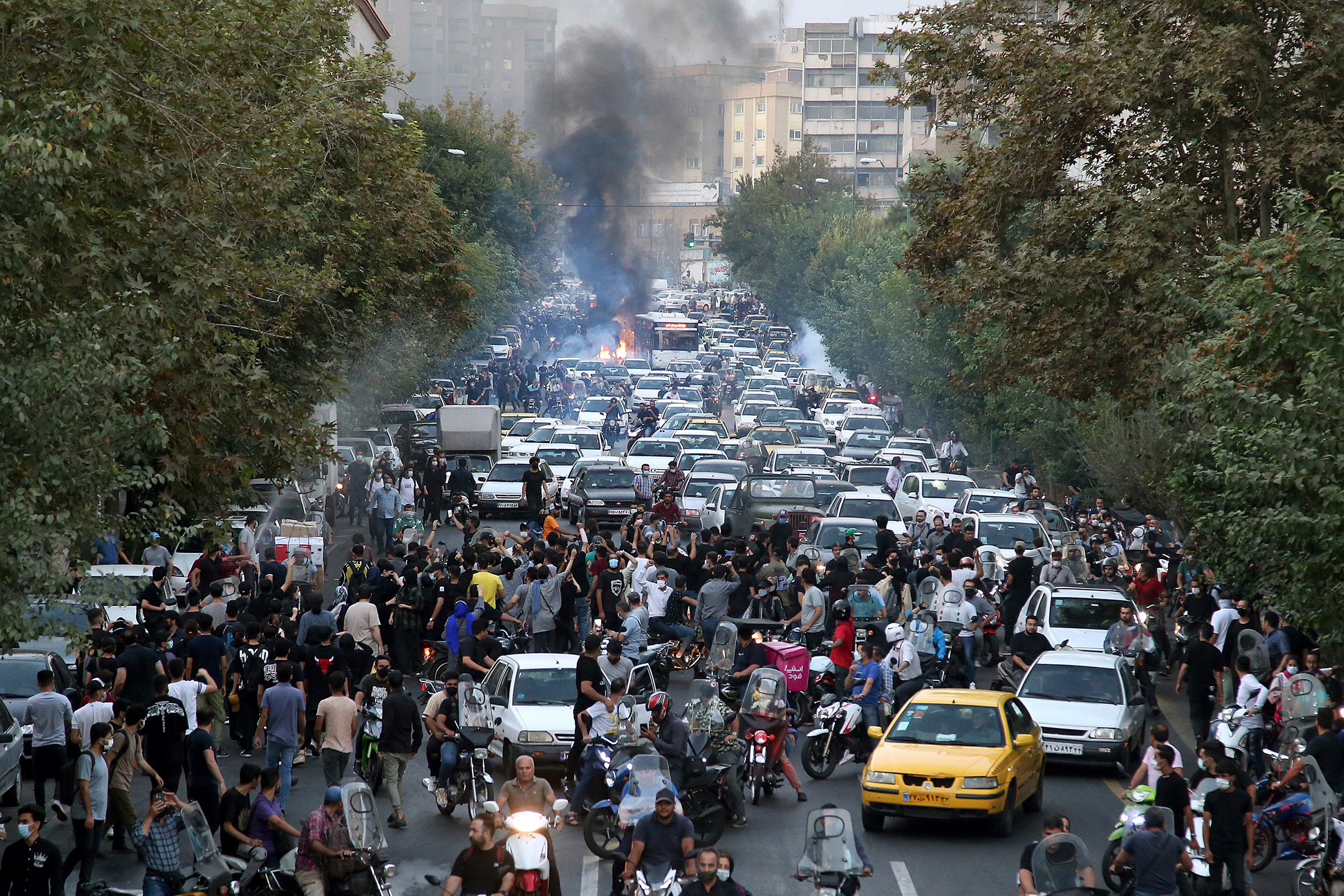 Protesters chant slogans over the death of a woman who was detained by the morality police, in downtown Tehran, Iran, on Sept. 21, 2022. 