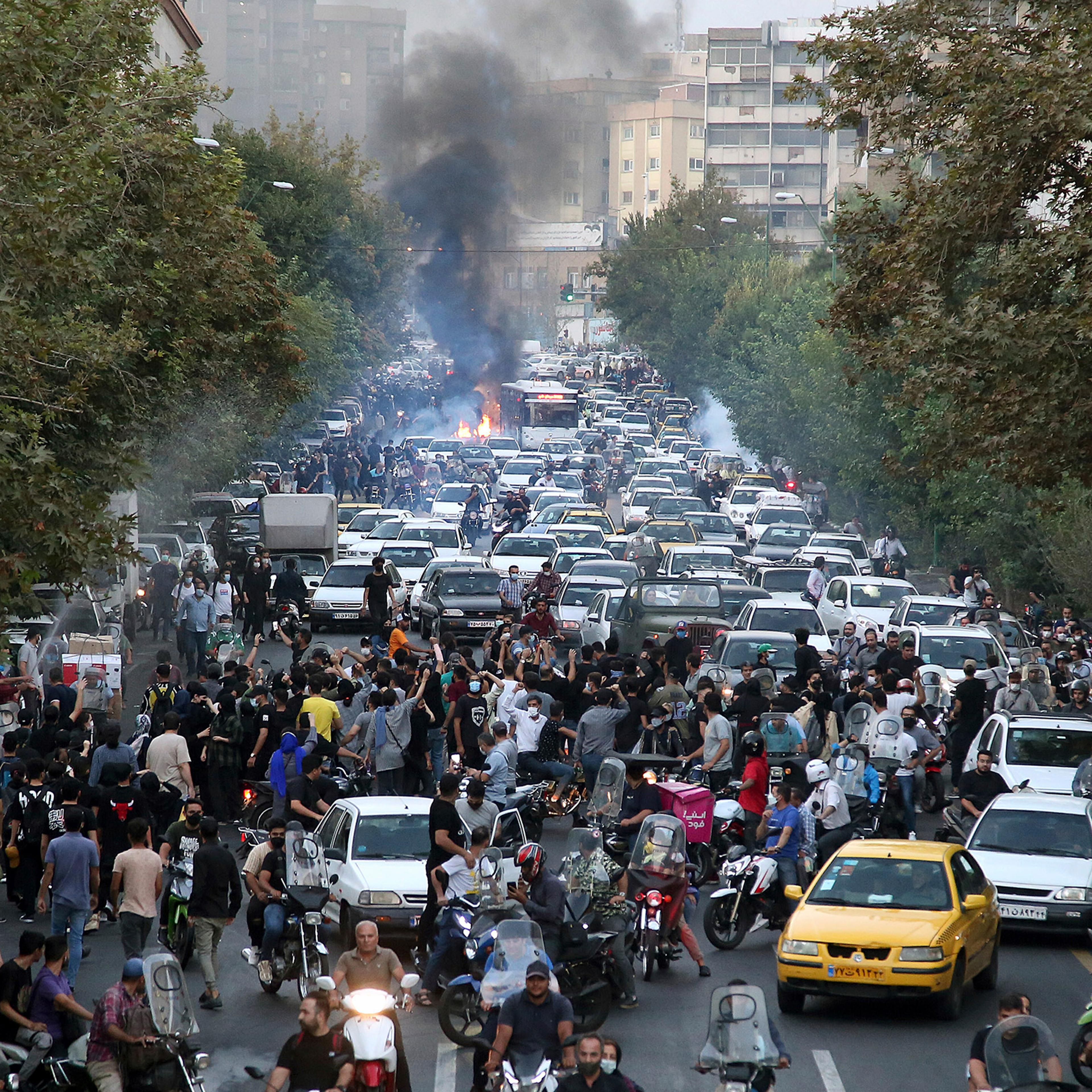 Protesters chant slogans over the death of a woman who was detained by the morality police, in downtown Tehran, Iran, on Sept. 21, 2022.