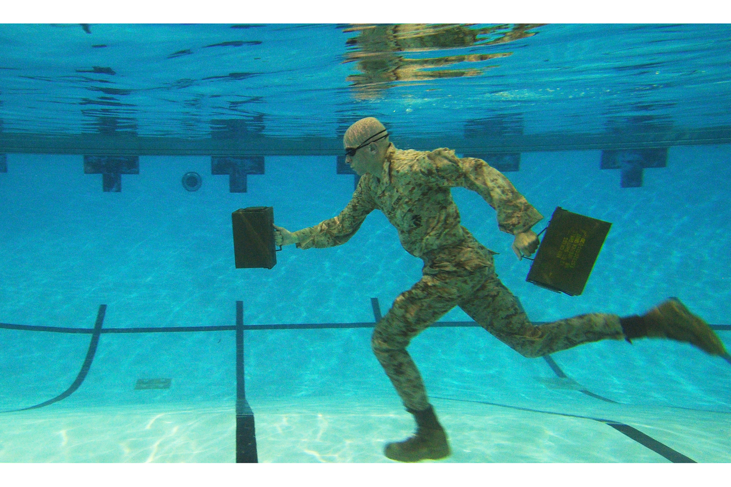<i>Water Running</i><br><br>Second Place, Sports. U.S. Marine Corps Lance Cpl. Reagan Lodge, Headquarters and Service Battalion, Marine Corps Base Quantico, conducts water running exercises during a physcal training session in Ramer Hall, The Basic School, on Marine Corps Base Quantico, Va. Sept. 14, 2011.