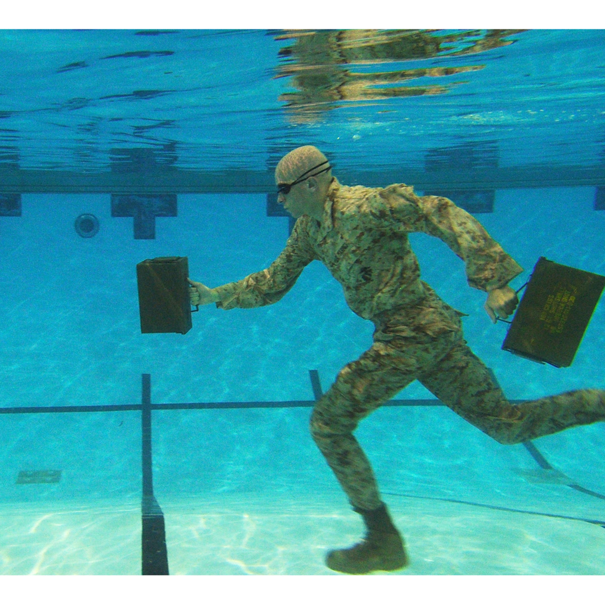 <i>Water Running</i><br><br>Second Place, Sports. U.S. Marine Corps Lance Cpl. Reagan Lodge, Headquarters and Service Battalion, Marine Corps Base Quantico, conducts water running exercises during a physcal training session in Ramer Hall, The Basic School, on Marine Corps Base Quantico, Va. Sept. 14, 2011.