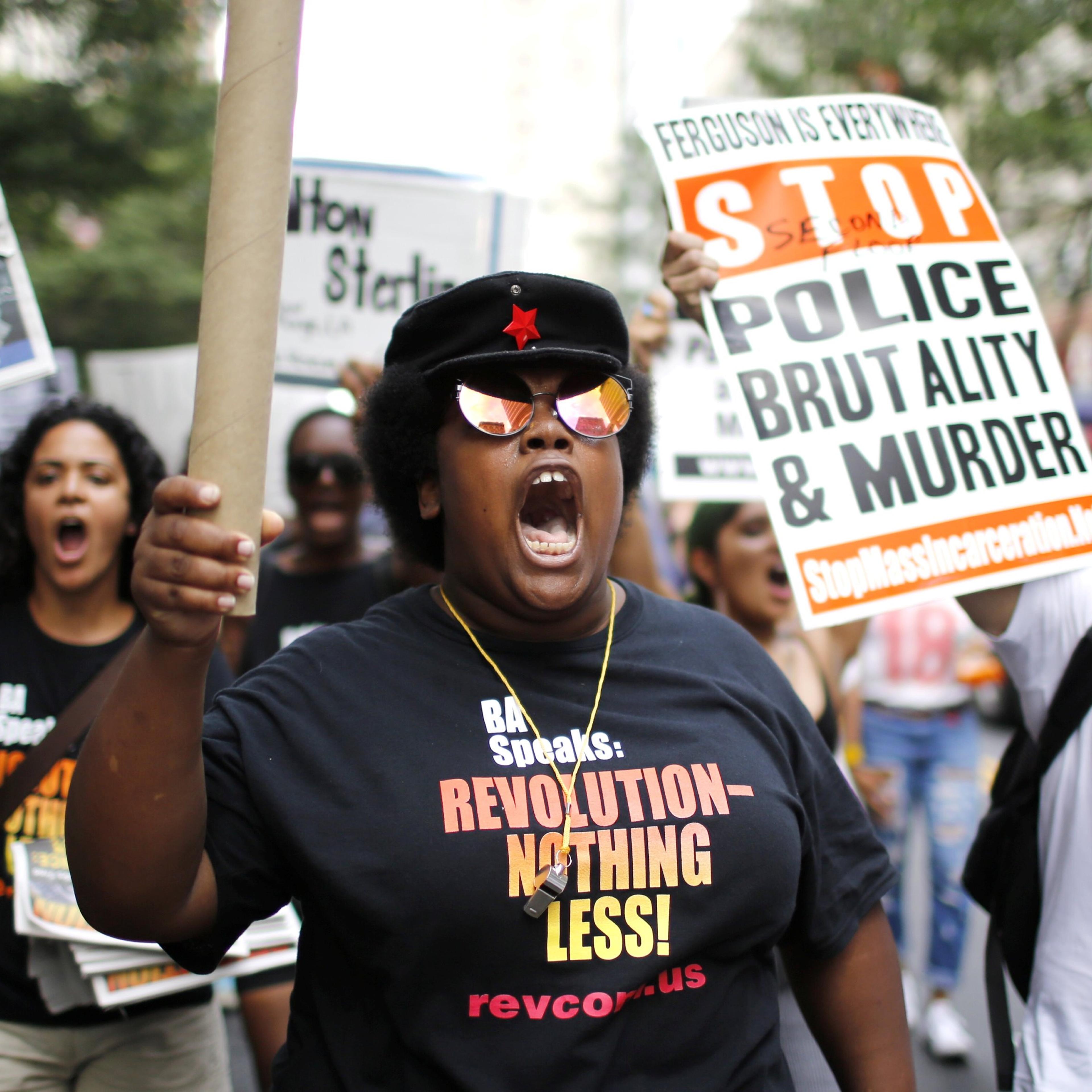 People take part in a protest for the killing of Alton Sterling and Philando Castile during a march along Manhattan's streets in New York