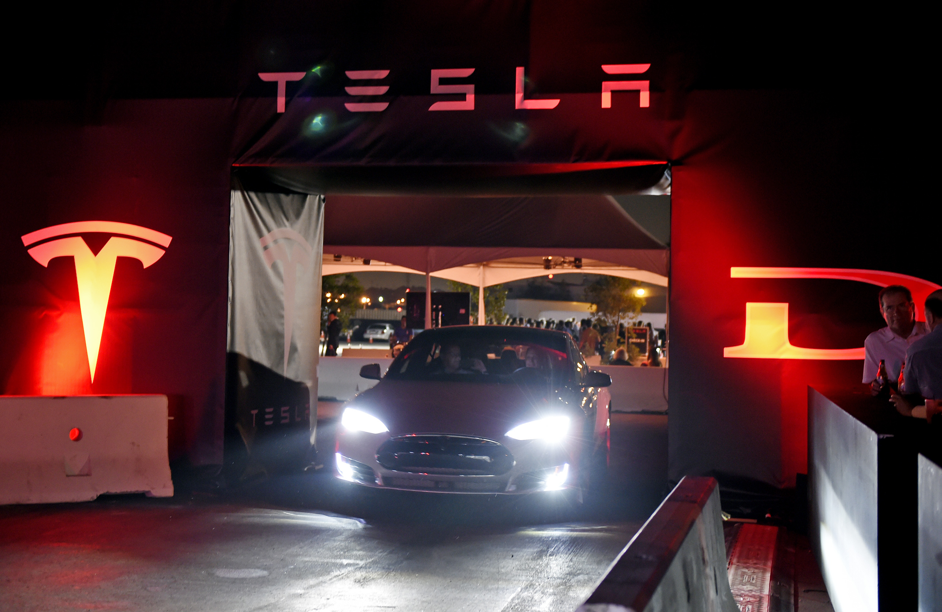 Tesla car with its lights on