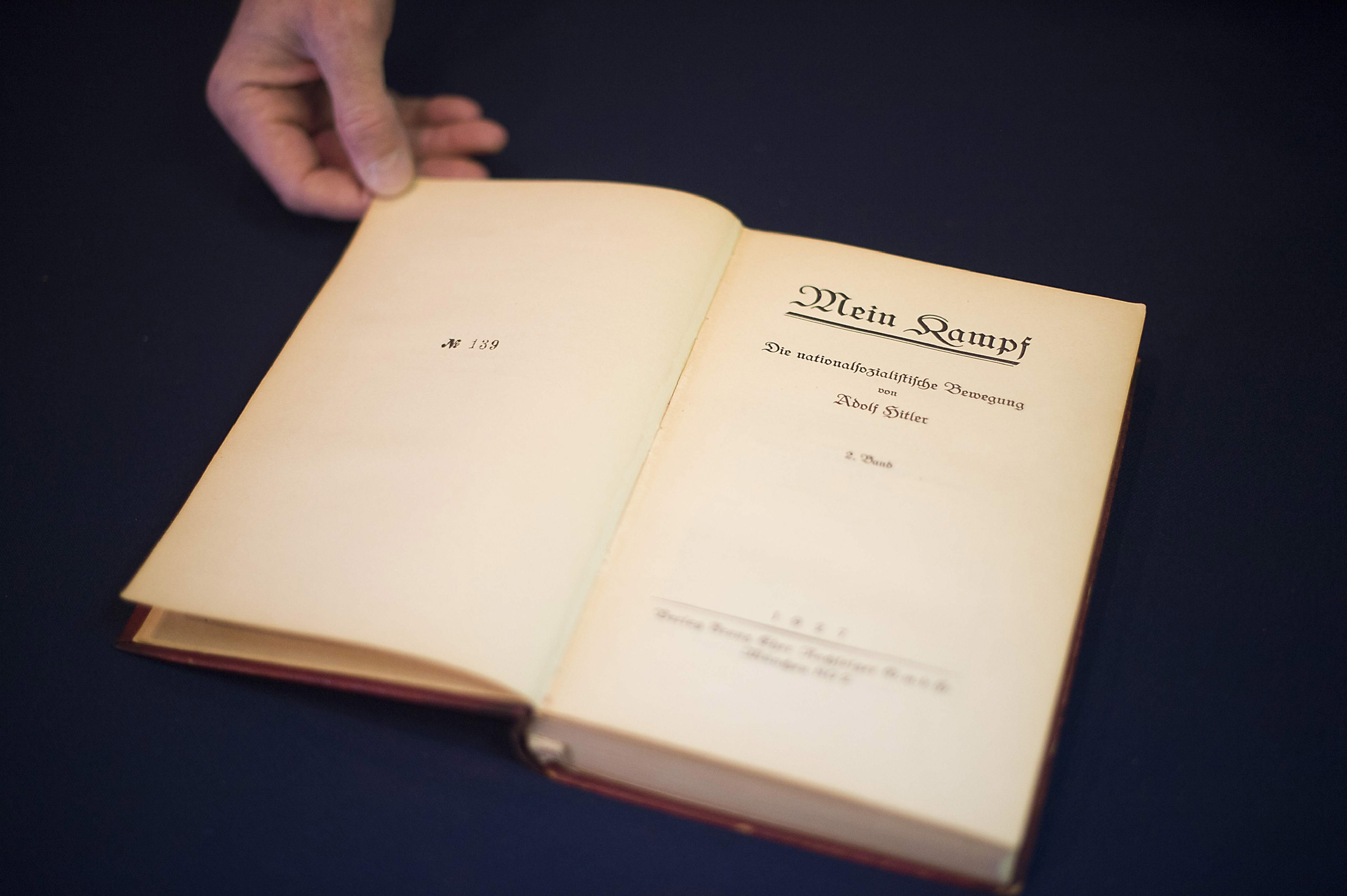 A copy of Nazi leader, Adolf Hitler's, political manifesto Mein Kampf, discovered at his Munich apartment and signed by eleven American officers, is on display March 18, 2016 before auction at Alexander Historical Auctions in Chesapeake City, Maryland. /