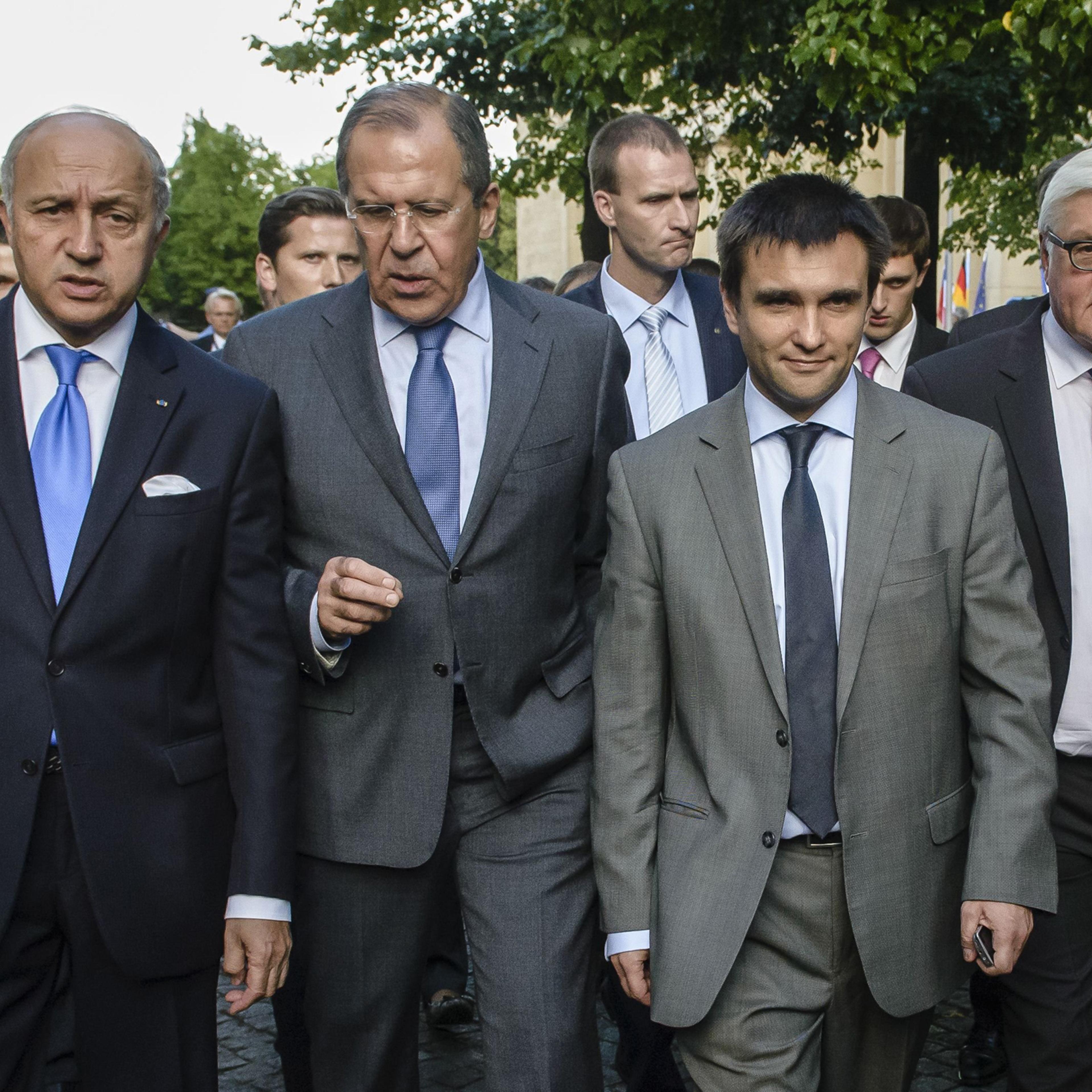French Foreign Minister Laurent Fabius, Russian Foreign Minister Sergei Lavrov, Ukrainian Foreign Minister Pavlo Klimkin and German Foreign Minister Frank-Walter Steinmeier leave the Federal Foreign Office after a joint press conference in Berlin on July