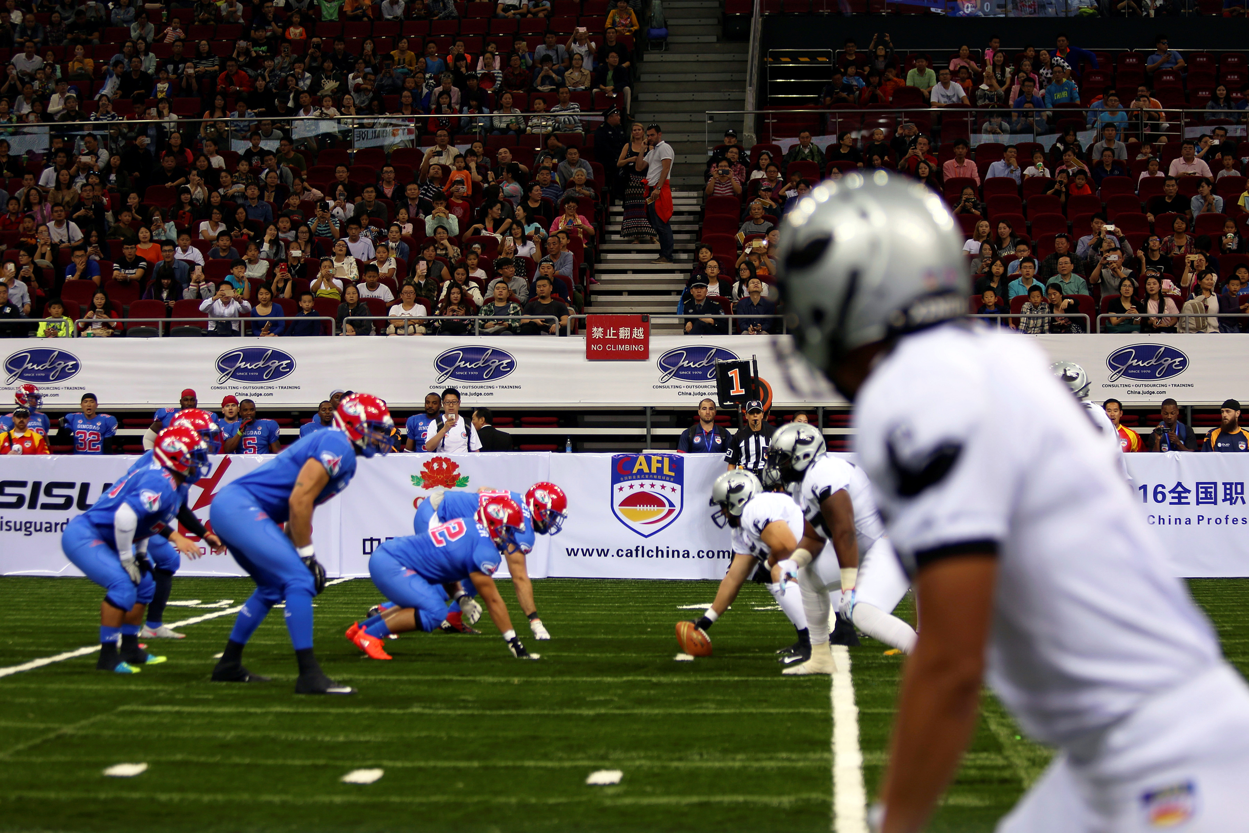 Arena Football - Qingdao v Guangzhou - China Arena Football League Super Series One - LeSports Center, Beijing, China - 1/10/16 Spectators watch teams Qingdao and Guangzhou in action. REUTERS/Iris Zhao - RTSQB7K