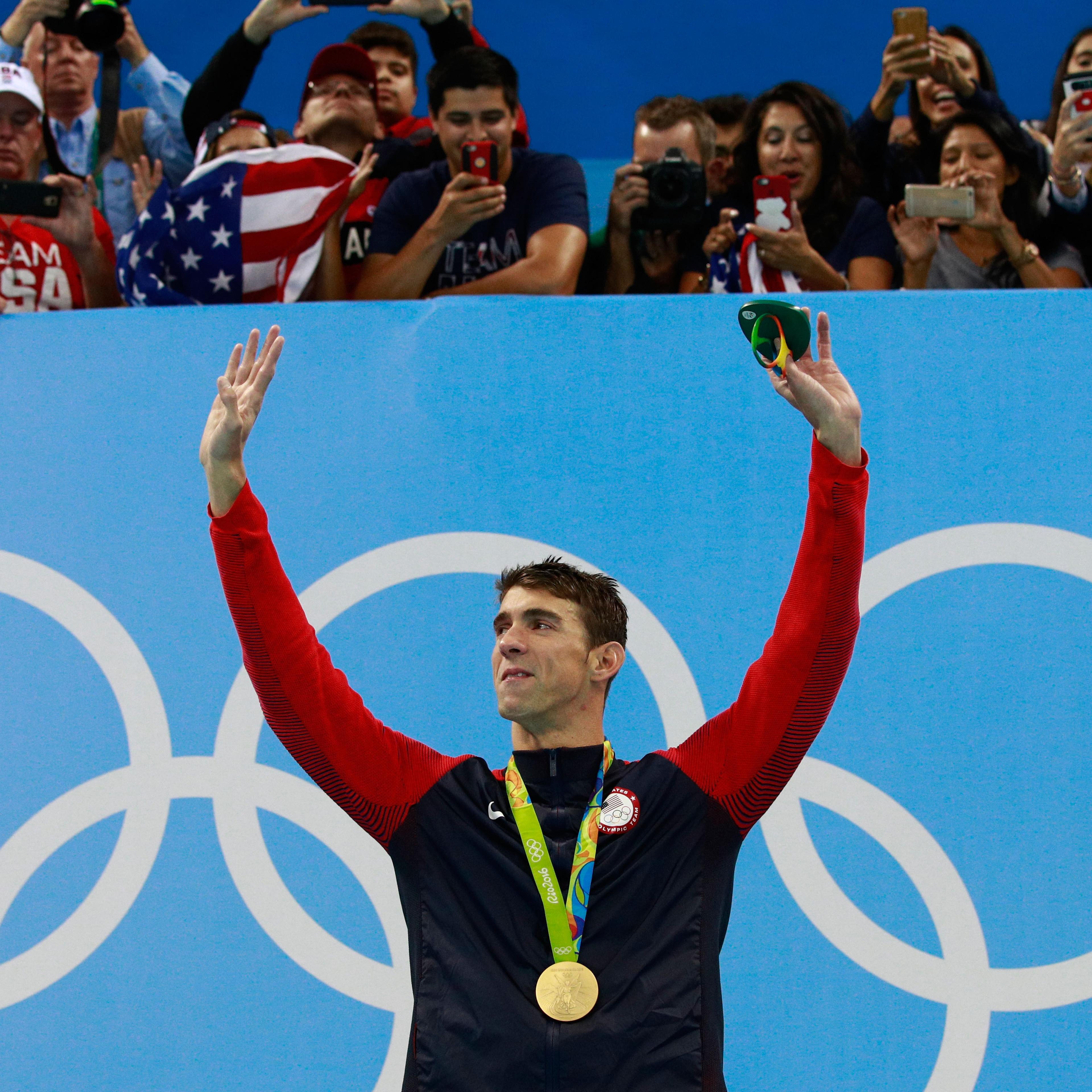Michael Phelps poses on the podium during the medal ceremony for the Men's 200m Individual Medley Final at the Rio Olympic Games on Aug. 11, 2016 in Rio de Janeiro.